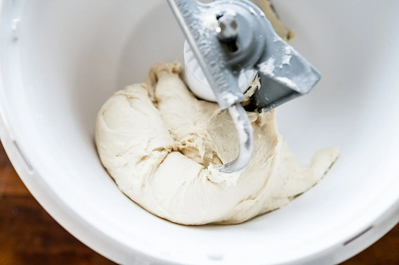 Cast Iron Pan Pizza Dough in Mixing Bowl Pulling Away From Sides