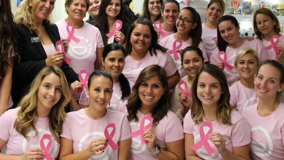 Orthodontic practice team supporting breast cancer awareness with pink ribbons.jpg