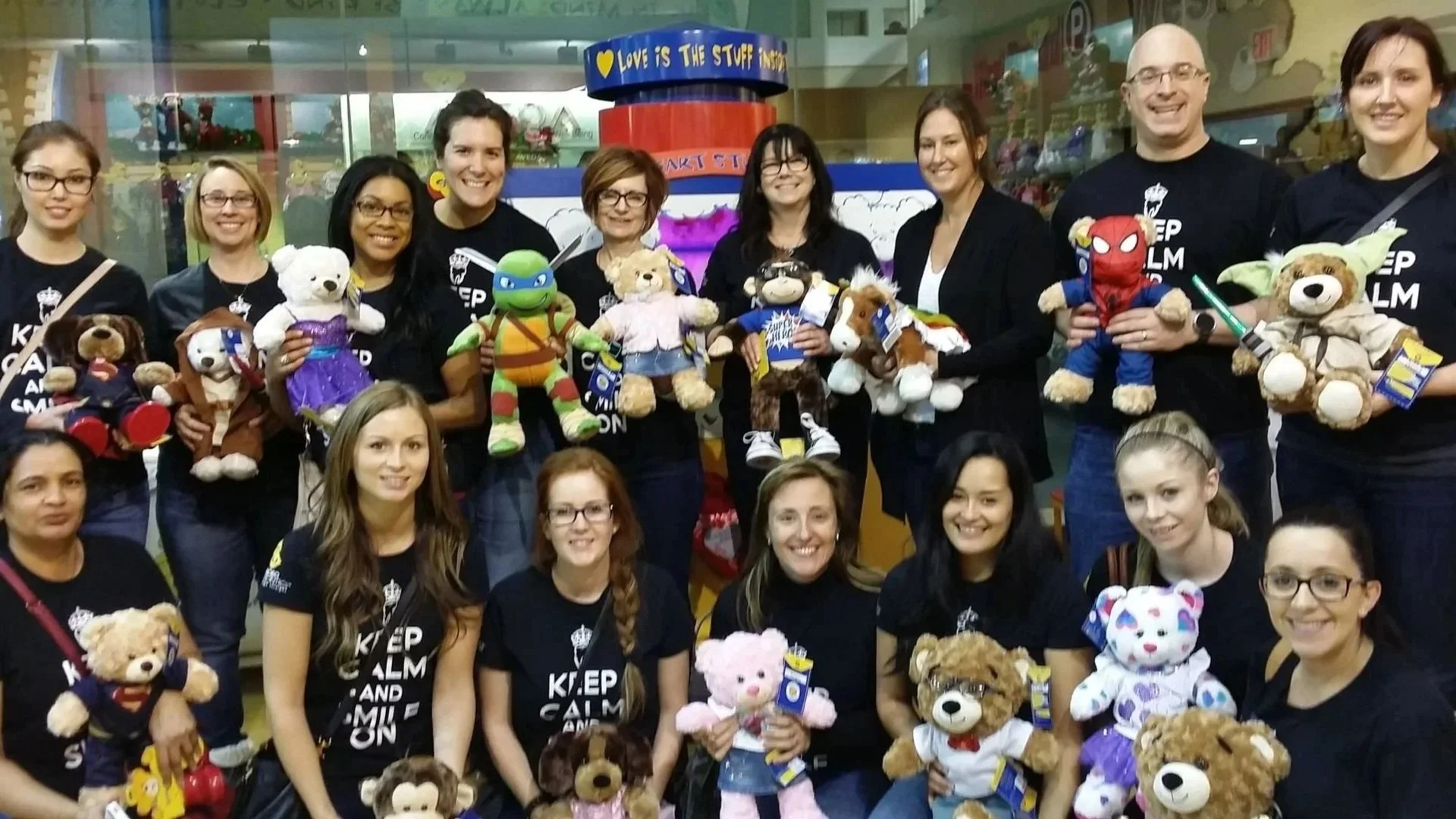 Orthodontic practice team at event holding stuffed animals.jpg