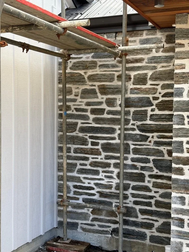 Natural stone exterior wall detail during construction of a Maddren Homes home in Weiti Bay