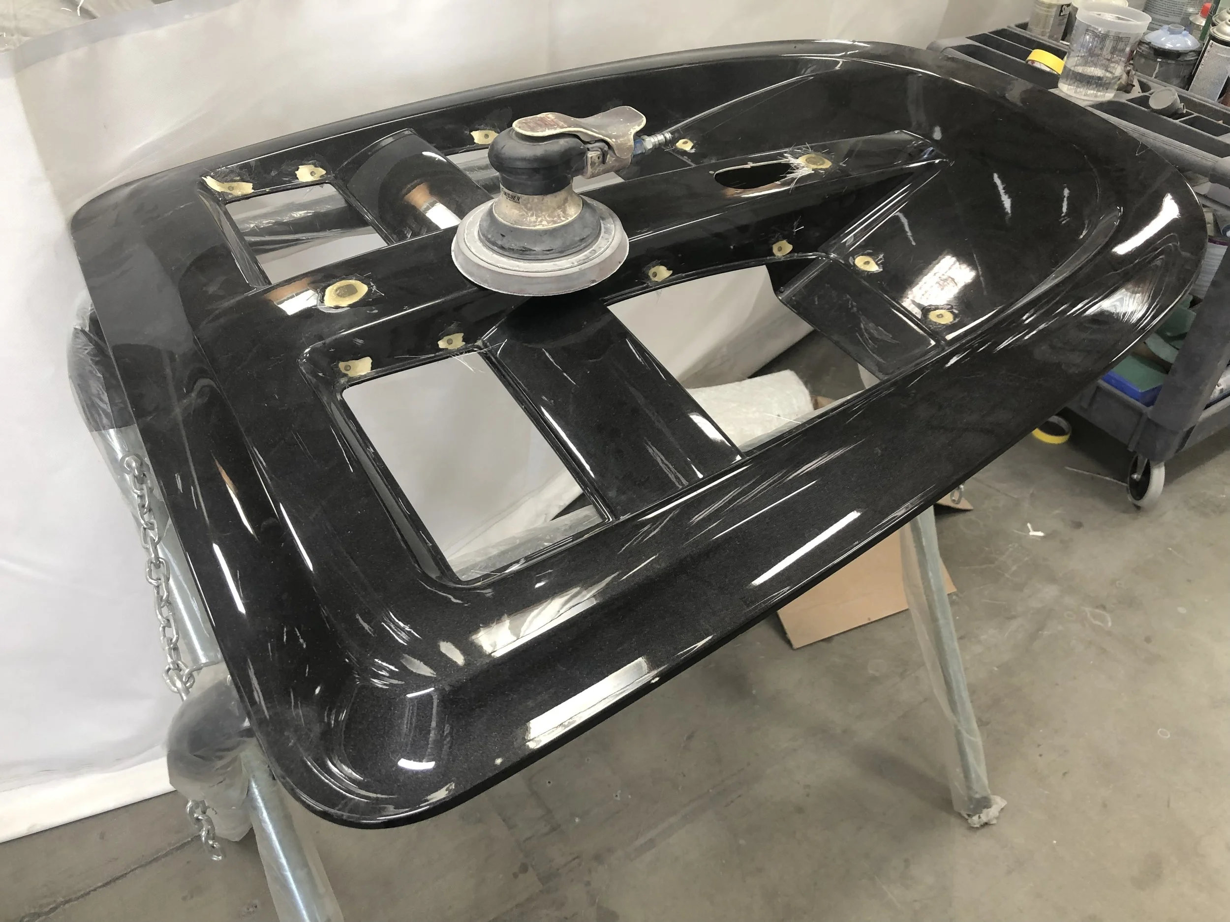 Sanding down the paint, filling holes and then shooting primer