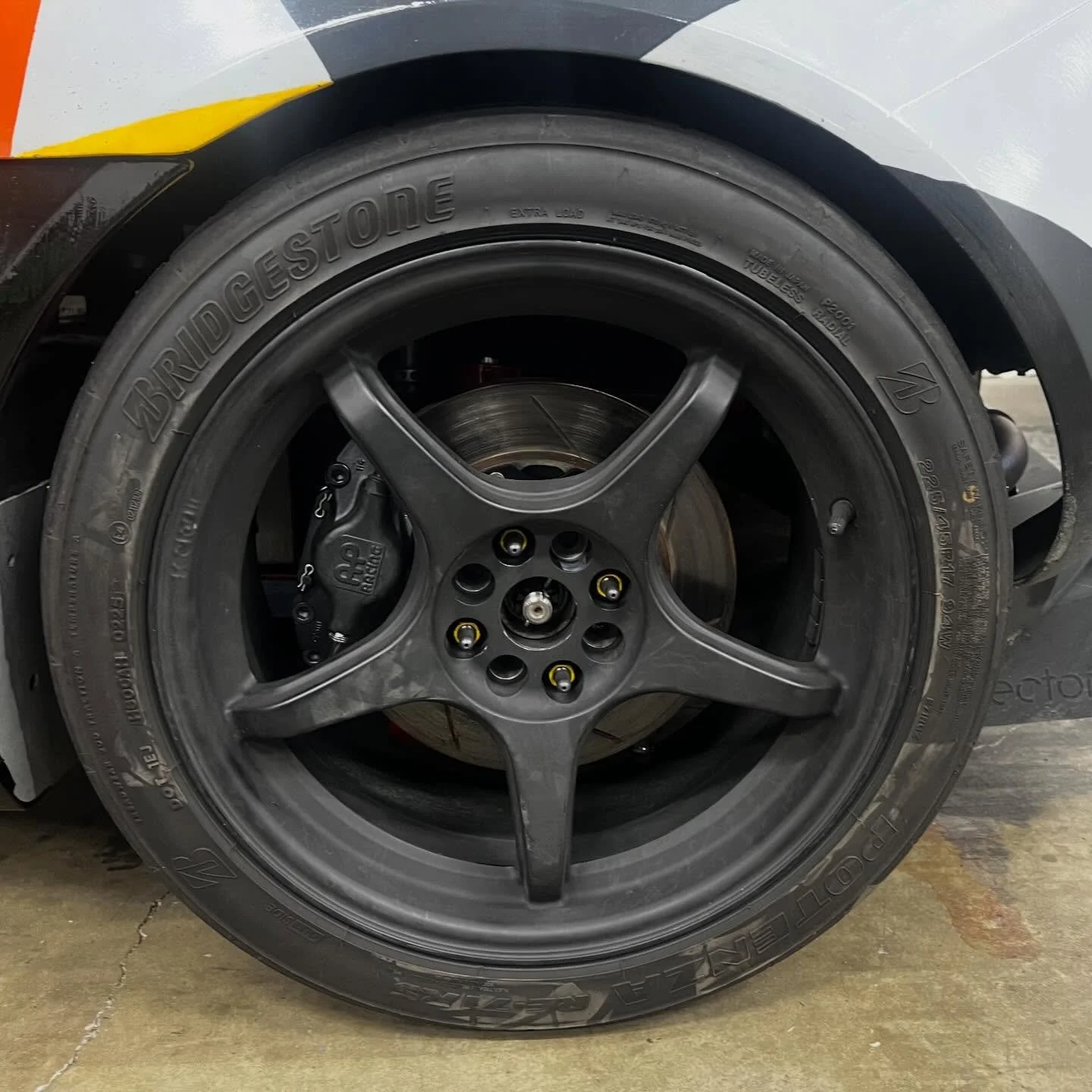 2piston caliper mounted to the rear - coupled with ABS delete and bias adjustment.  Track testing soon.