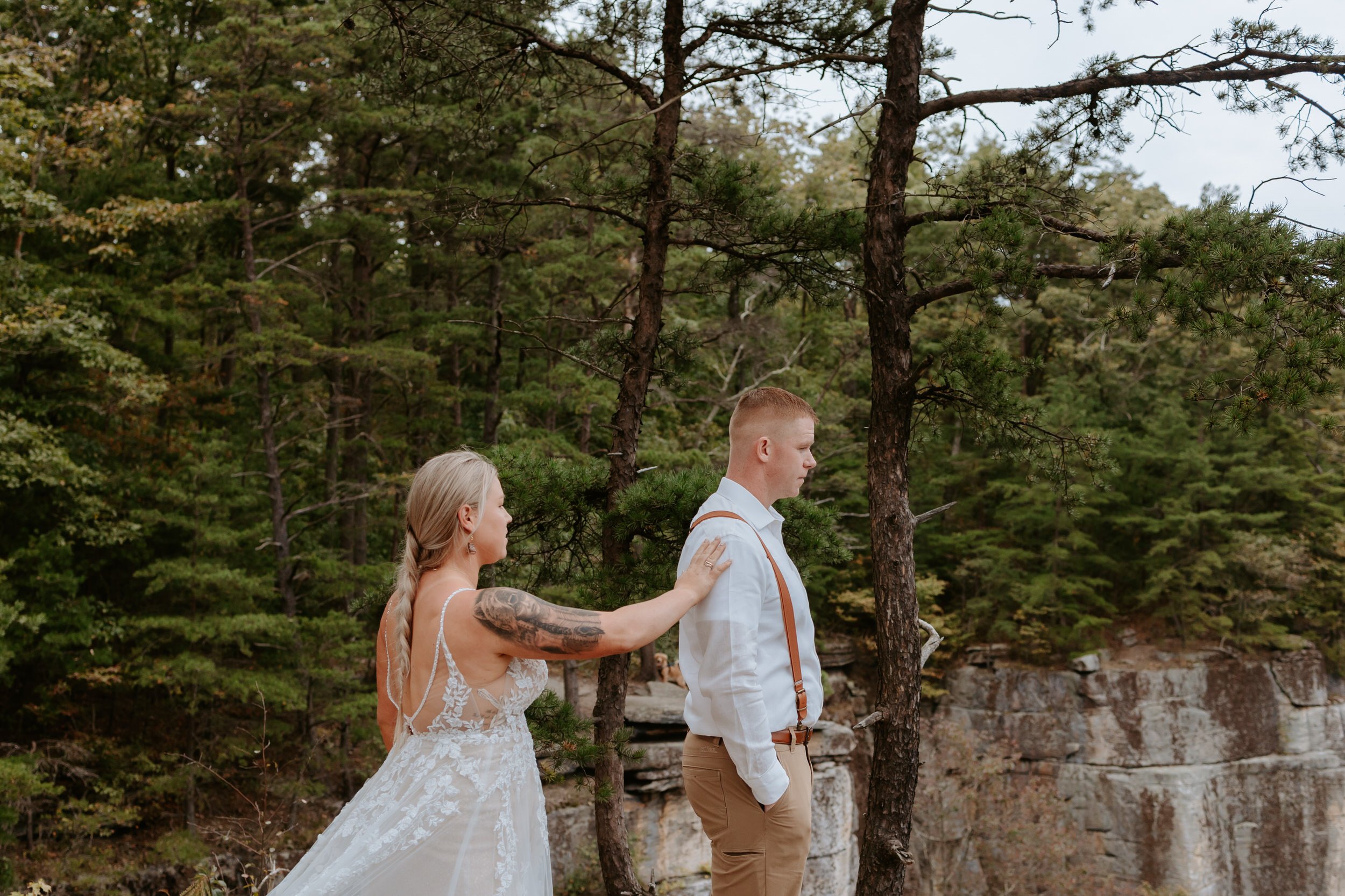 Bride taps groom on shoulder for first look at New River Gorge.