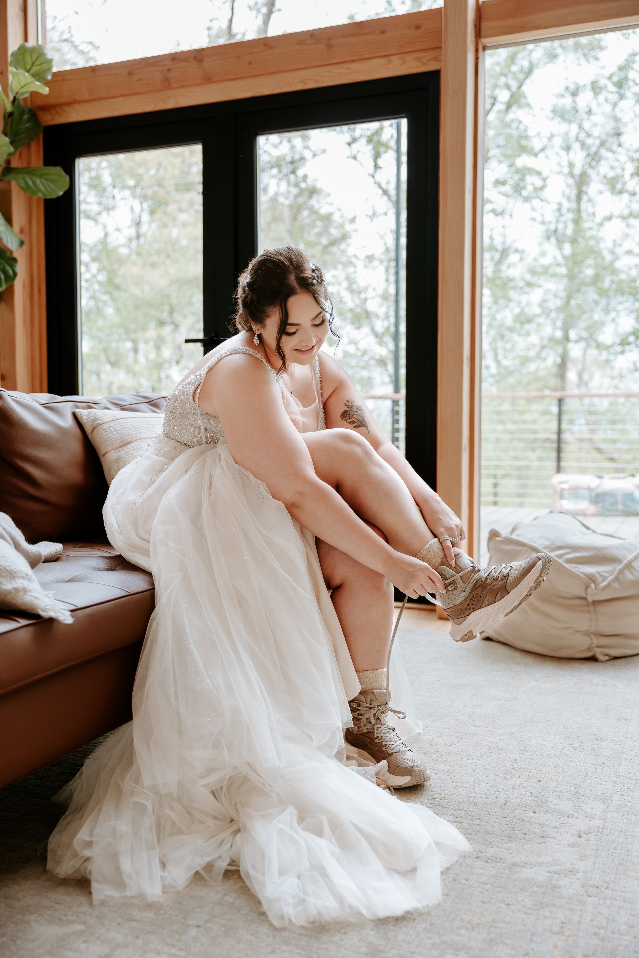 Bride puts on hiking boots.
