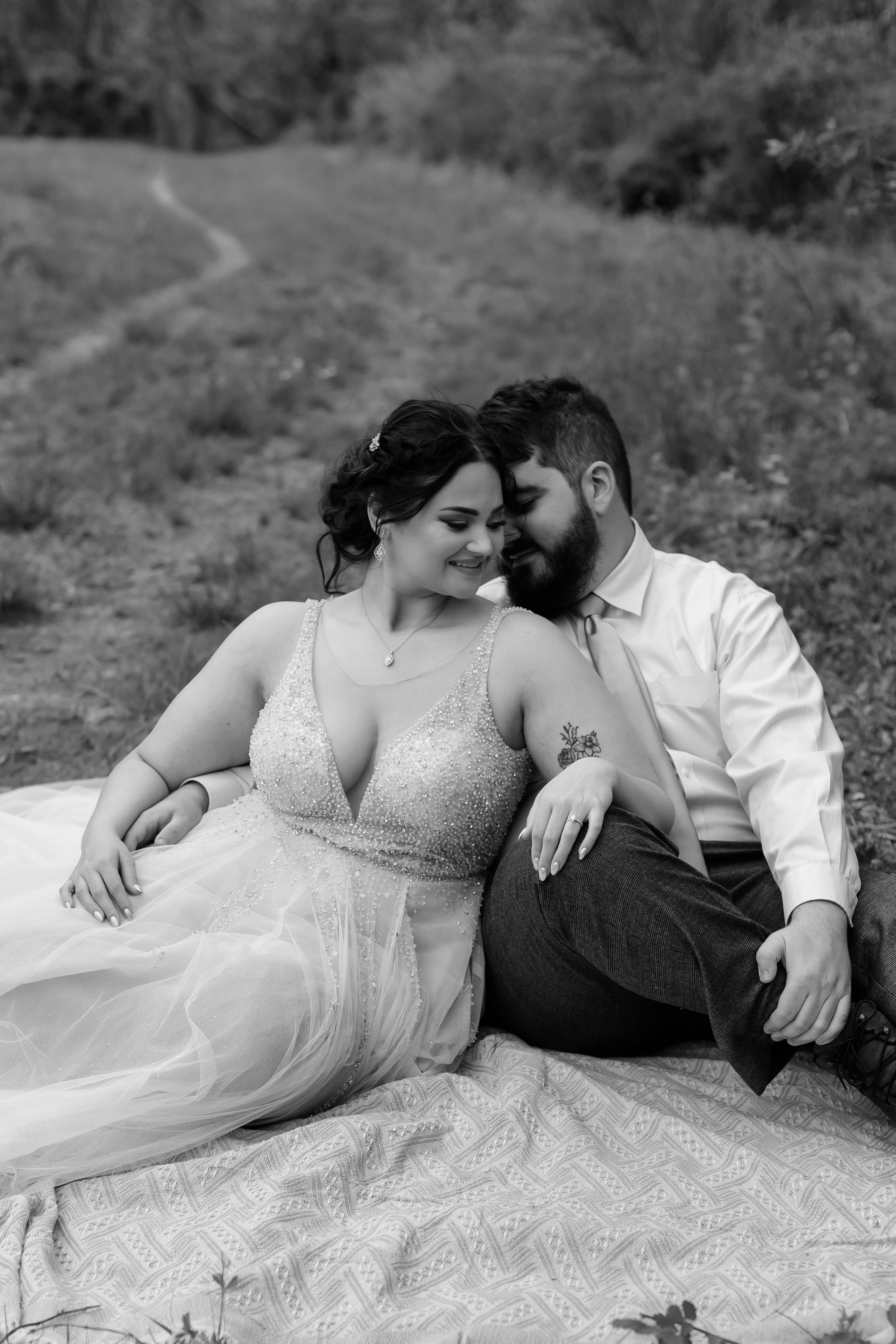 Groom snuggles his nose into brides cheek.