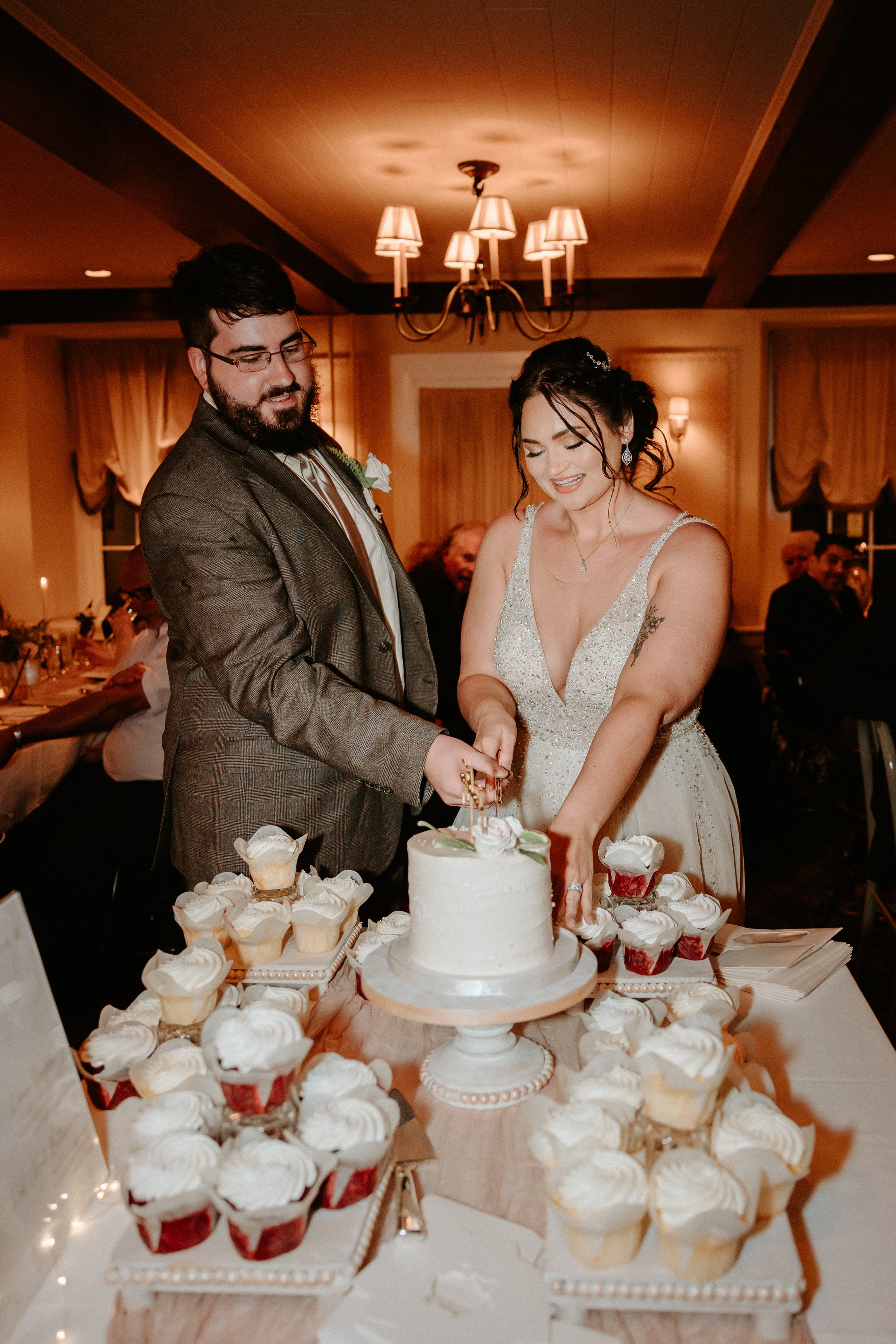 Bride and groom cut their wedding cake.