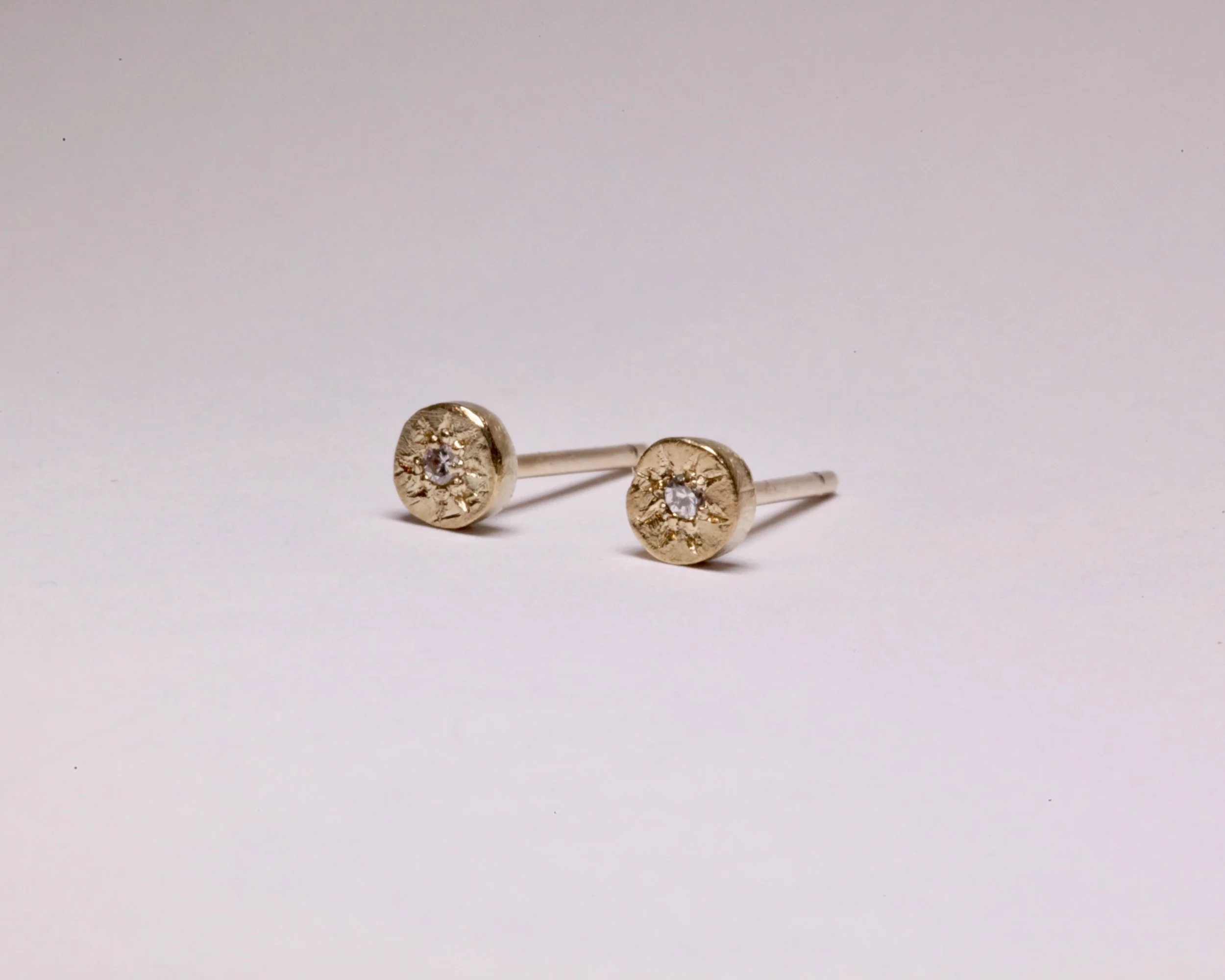 Sole diamond stud earrings