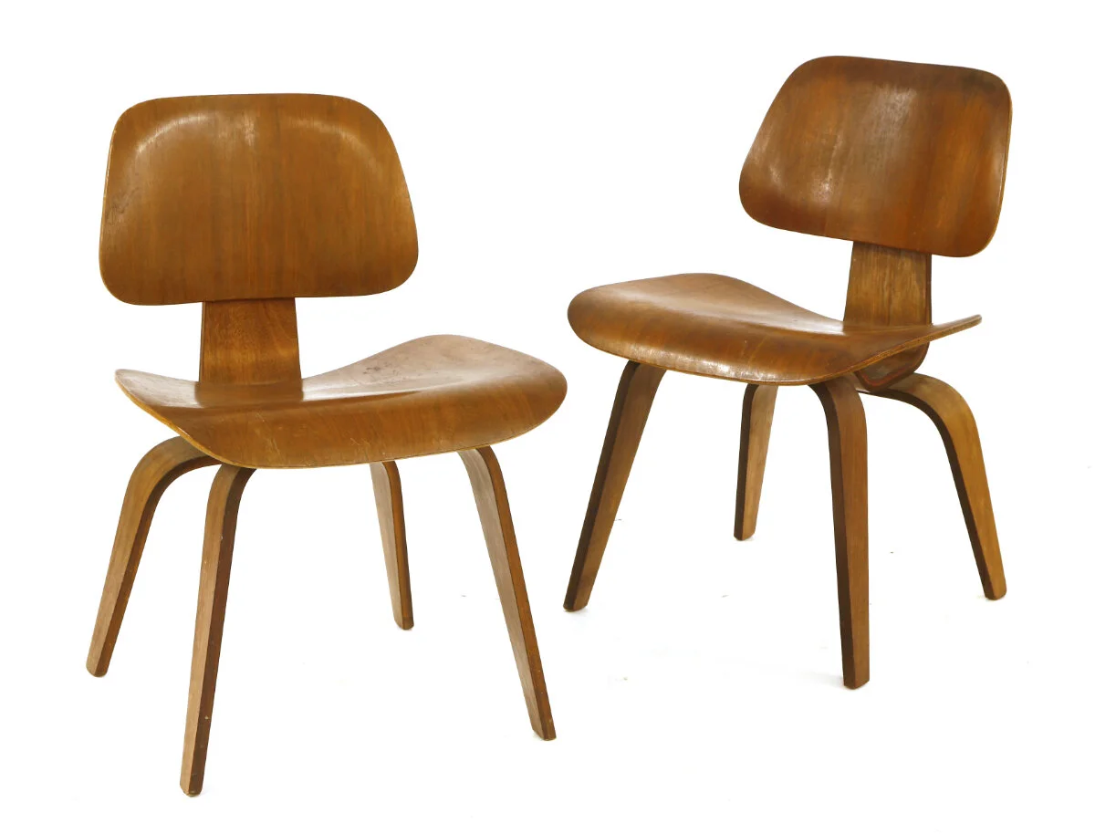 A DCW chair, designed by Charles and Ray Eames for Herman Miller in 1946, labelled 'Charles Eames design Herman Miller Zeeland Michigan', and another. These chairs have been on loan at the London Design Museum since 1993. The vendor, Johan Polak, lived in Philadelphia and worked for the United Nations as a graphic artist. Estimate: £400-600