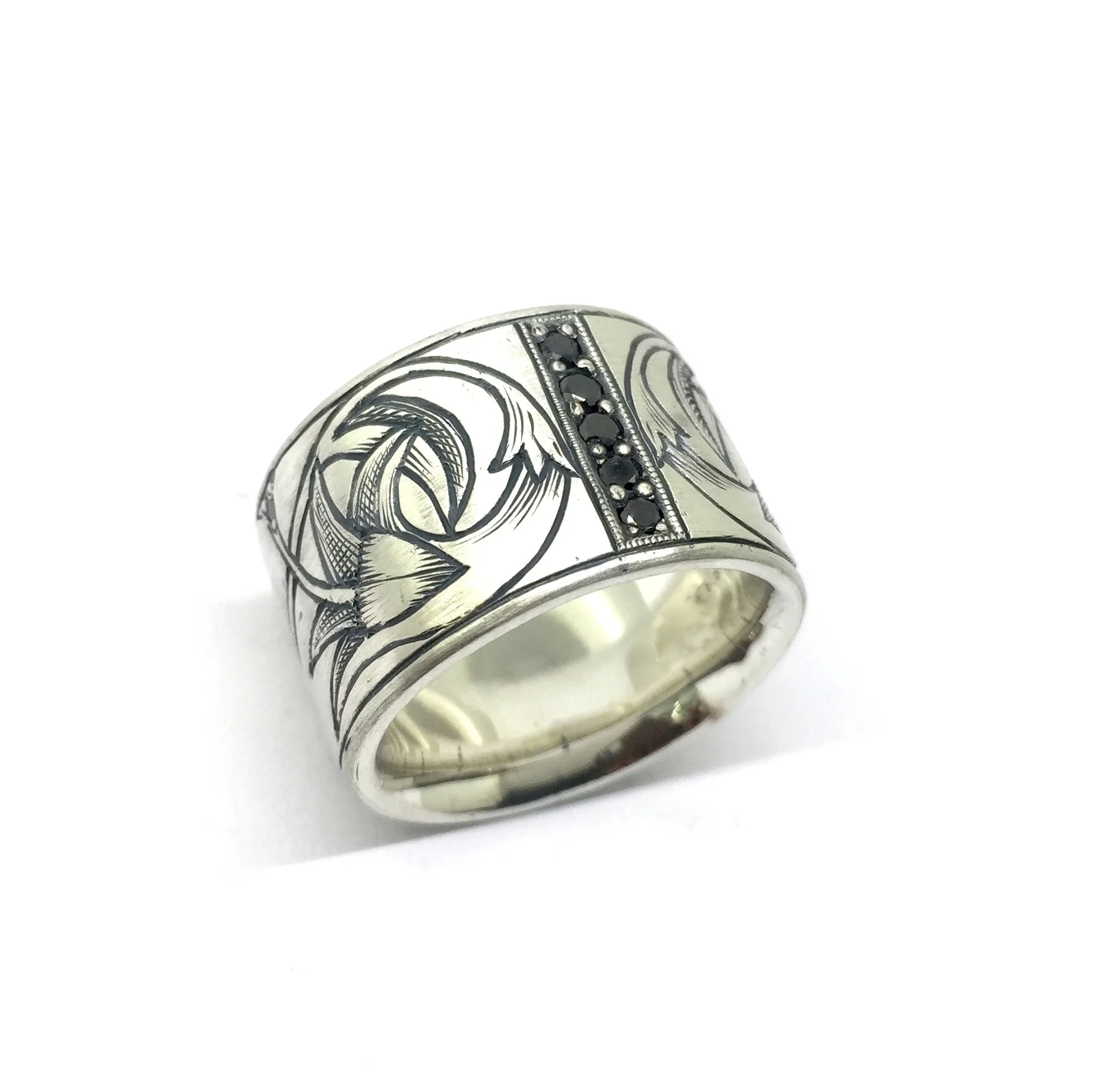 Sterling silver custom ring with hand-engraved detail and black diamonds
