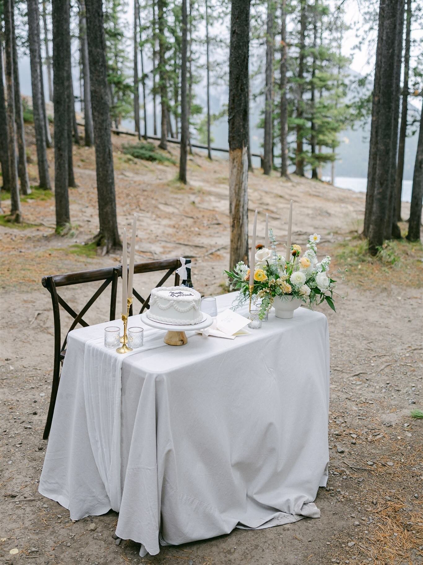A table for two in the forest&mdash;champagne, a little cake to celebrate, and the quiet beauty of nature all around. Intimate touches like this can make your elopement day feel extra special without needing a big reception. 

Whether it&rsquo;s a si