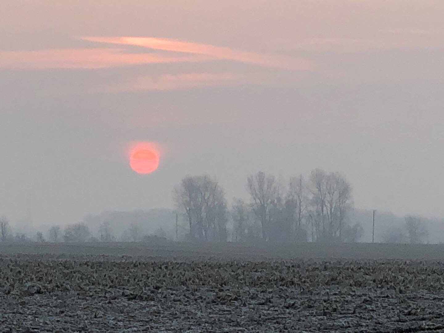 I normally don&rsquo;t post digitally zoomed images because the quality is so bad, but it was such a pretty sunrise I decided to make an exception. A minute or two earlier and the sun looked twice as big lower in the horizon. 
&bull;
&bull;

#home #h