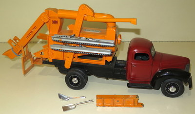 This Highway 66 truck is hauling a custom-built Minneapolis-Moline corn sheller