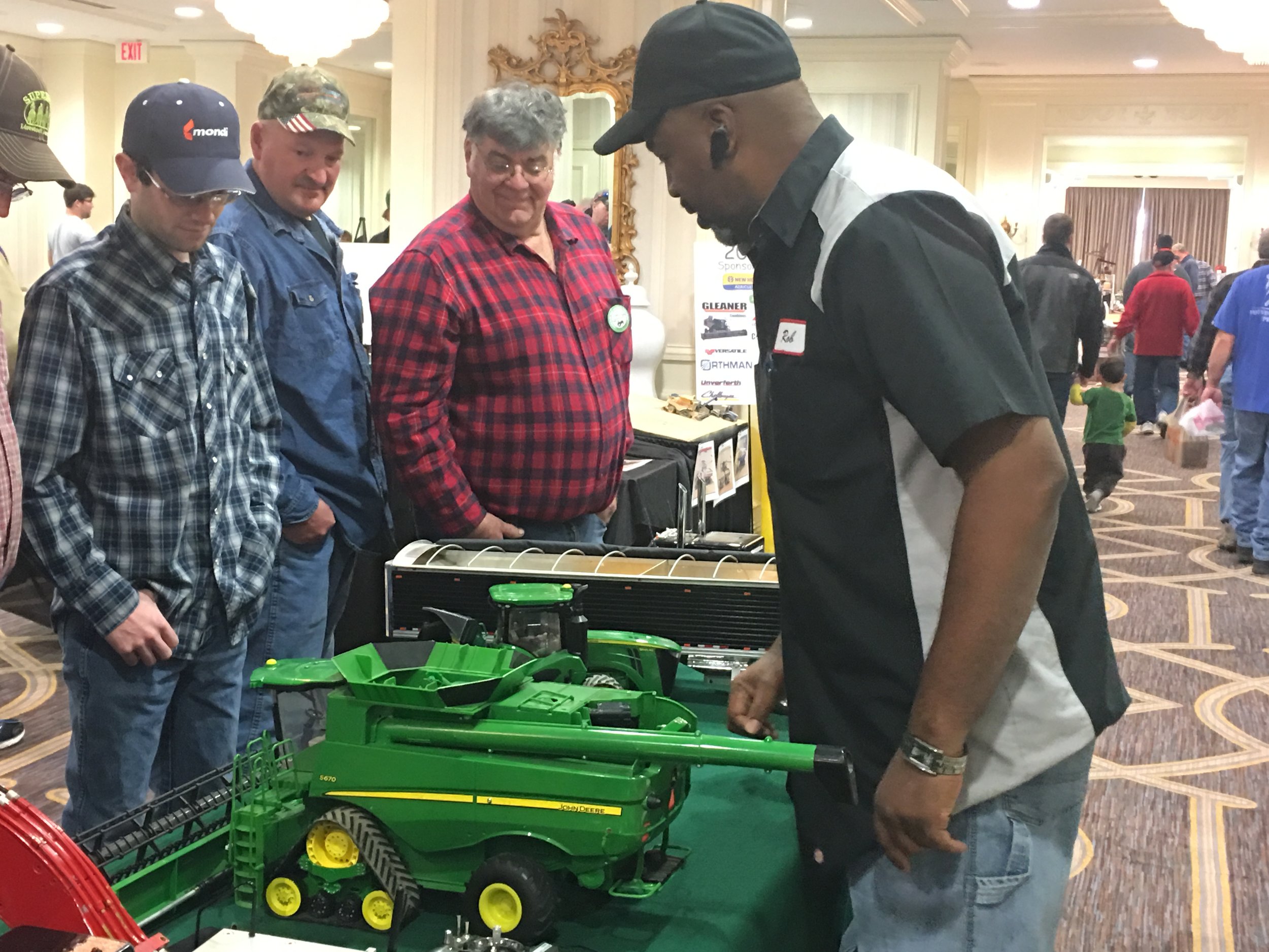 Robert Denson with a crowd around him and his remote-control models