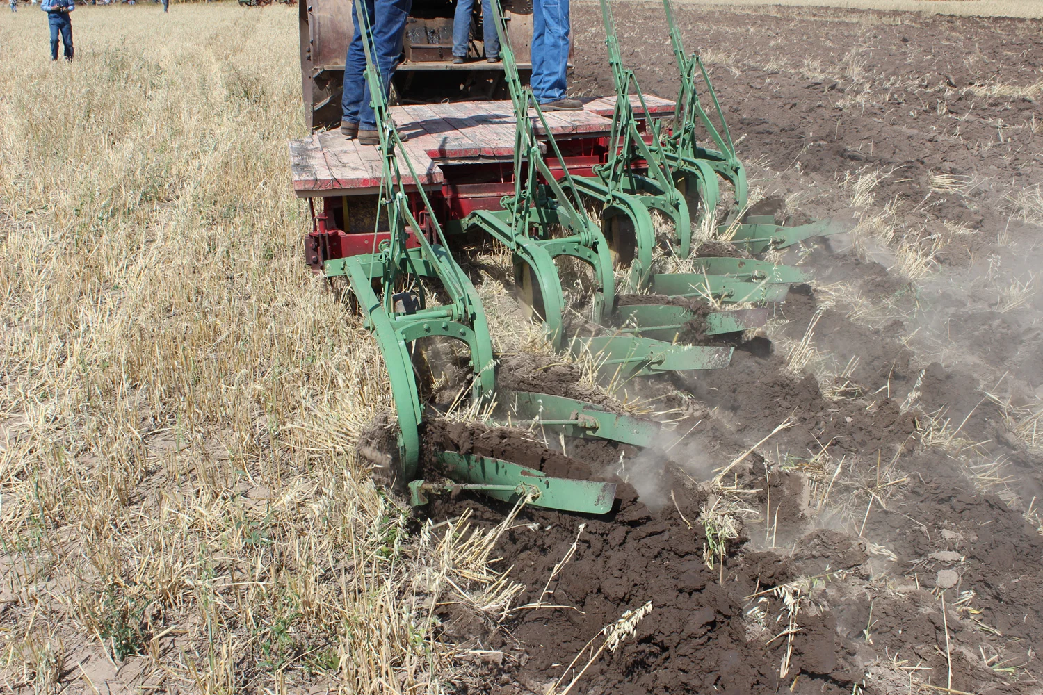The John Deere plow is doing well in the dry Montana soil. This grain stubble is not as difficult to plow as the original Prairie sod, which was tramped by the mighty bison herds. Photo Luke Steinberger