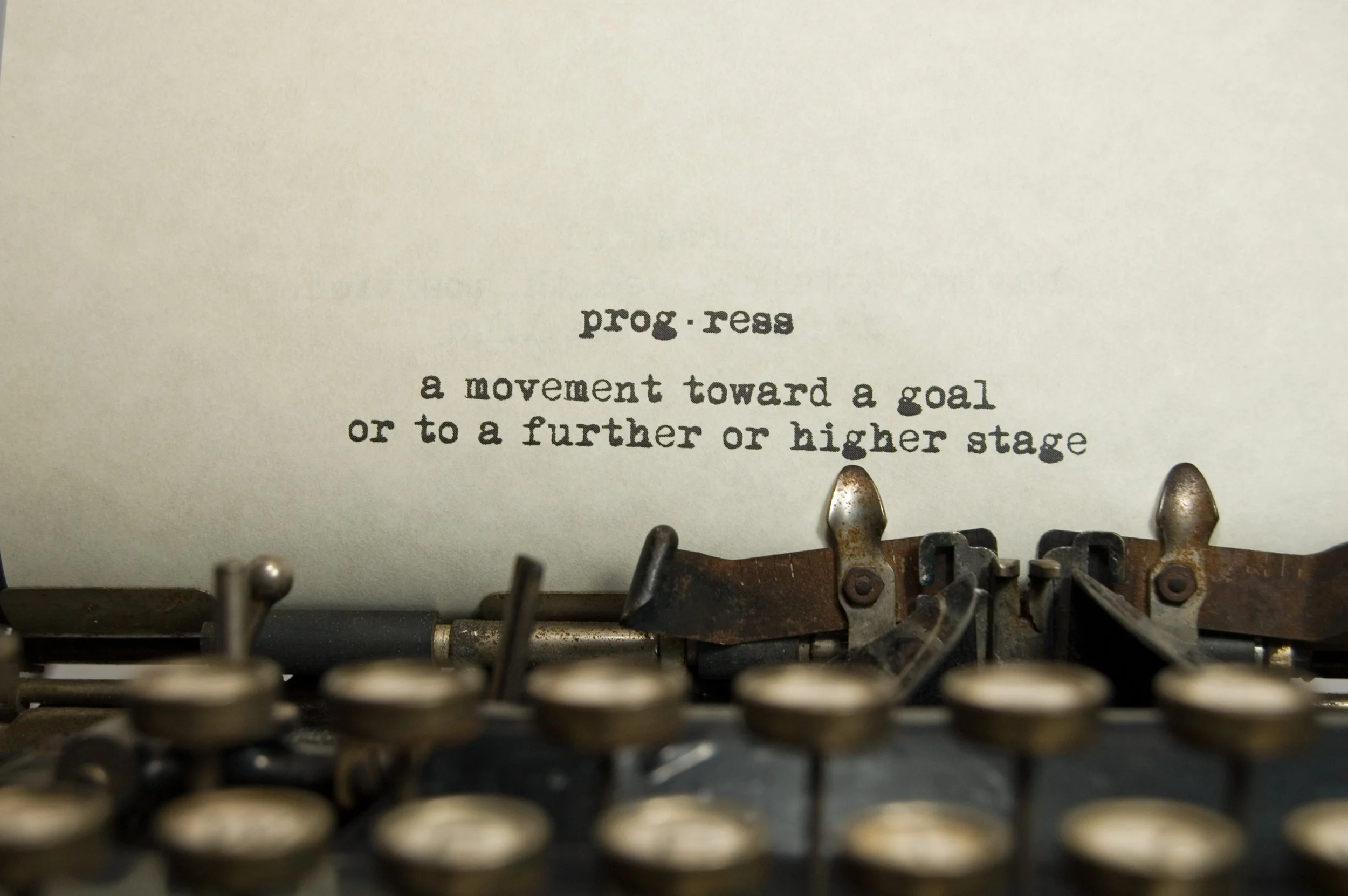 Progress-definition-on-an-old-typewriter-170616313_2900x1928.jpeg
