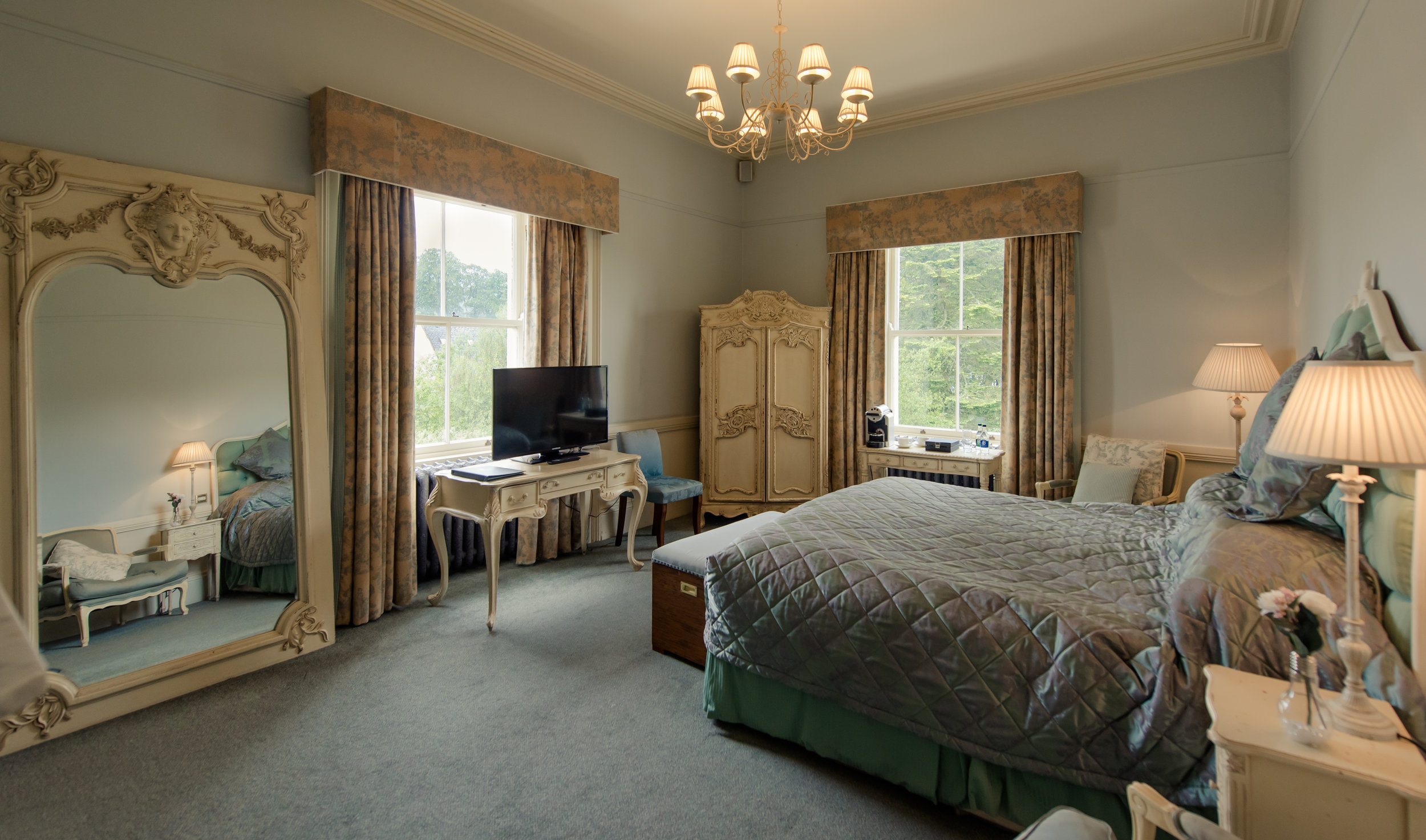 Tulfarris Hotel & Golf Resort Manor House large luxurious bedroom with large mirror.jpg