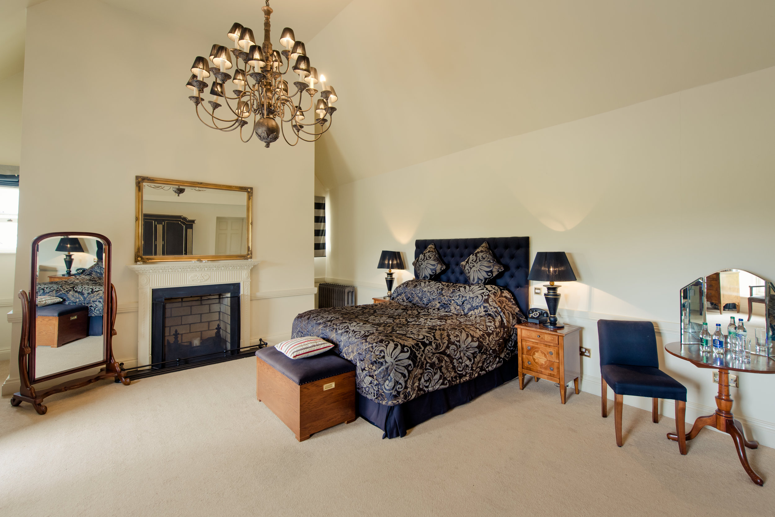 Tulfarris Hotel & Golf Resort Manor House luxurious bedroom with chandelier.jpg