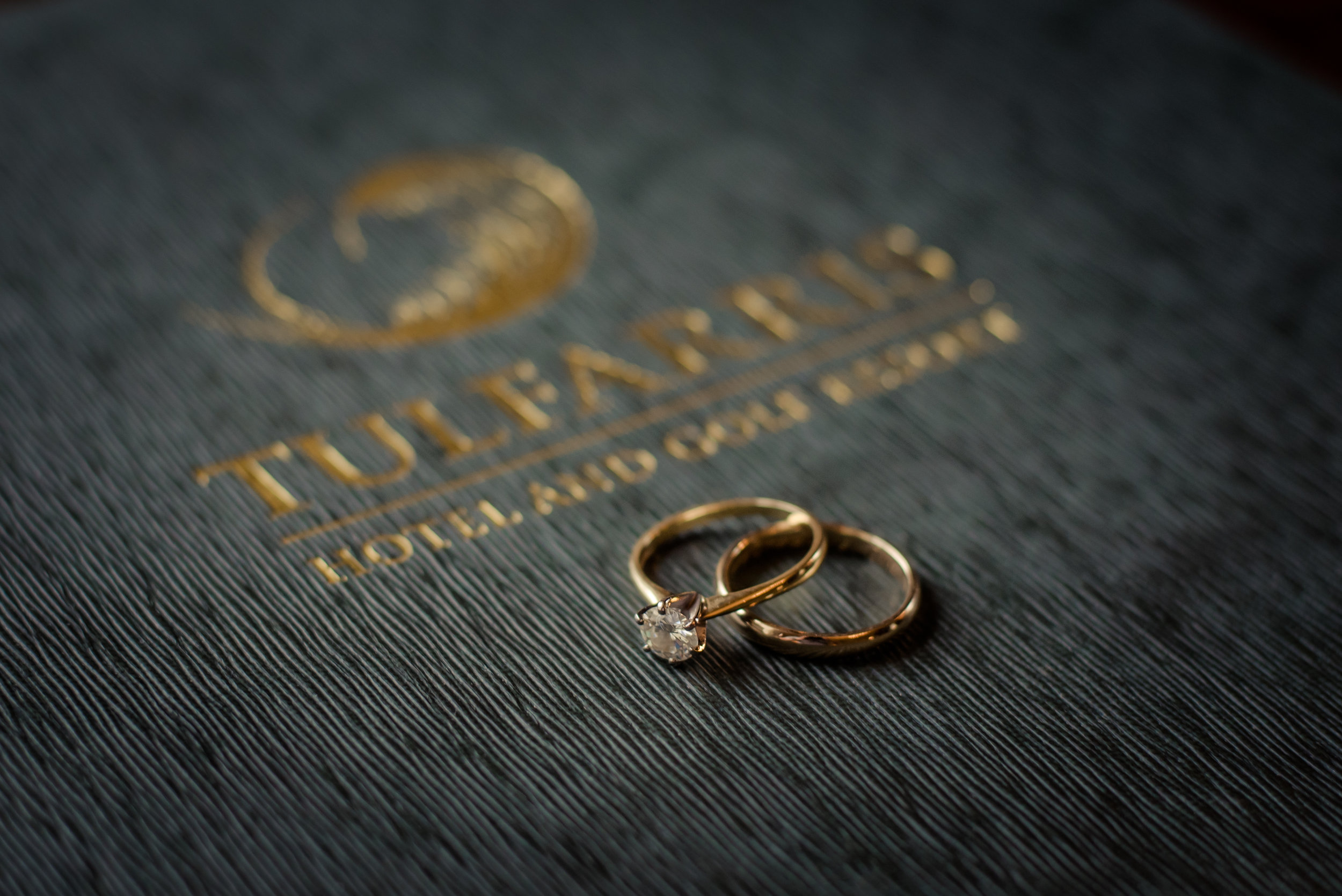 Tulfarris Hotel & Golf Resort wedding rings on bedroom information booklet.jpg