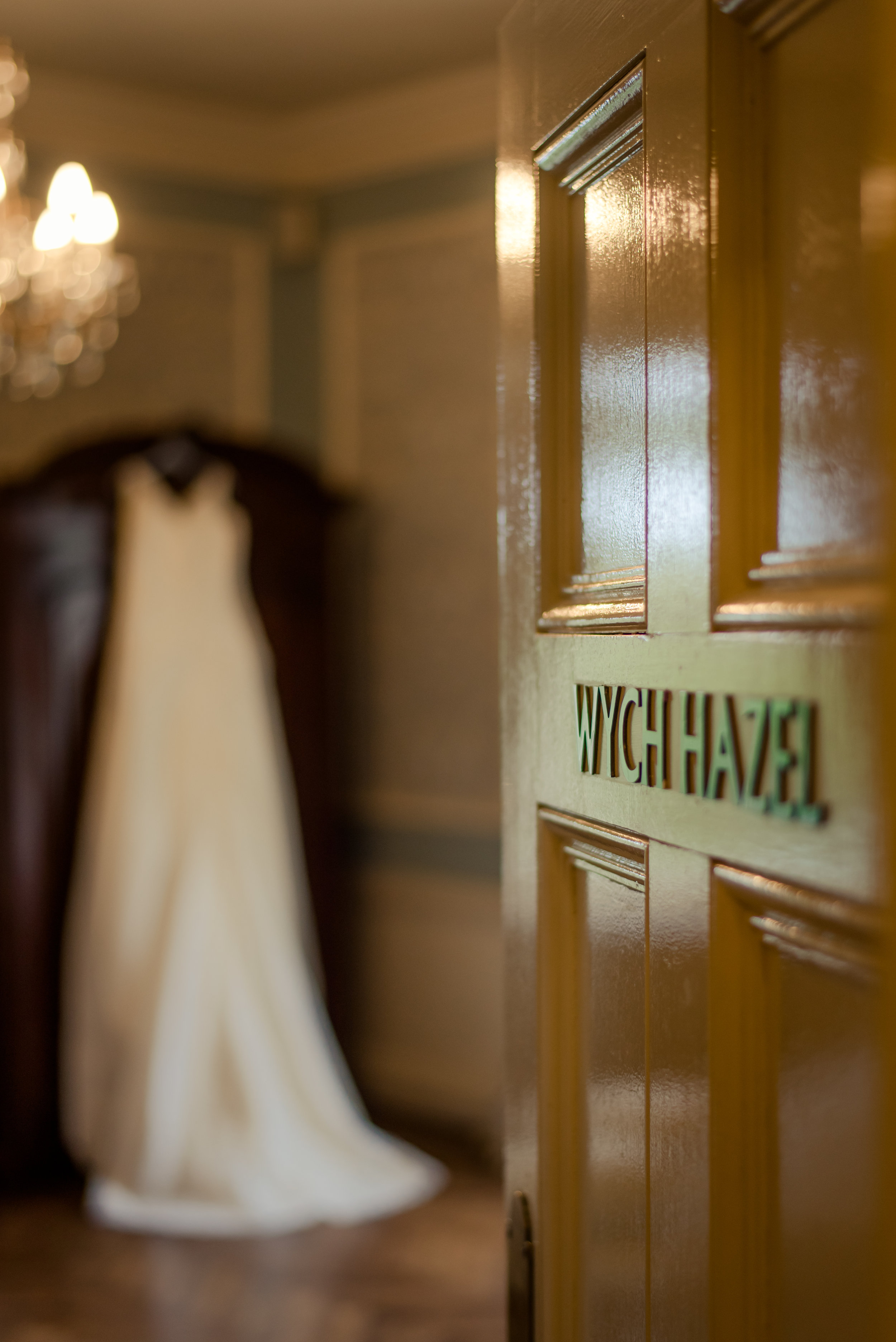 Tulfarris Hotel & Golf Resort Wych Hazel bridal suite with door open a wedding dress hanging up.jpg