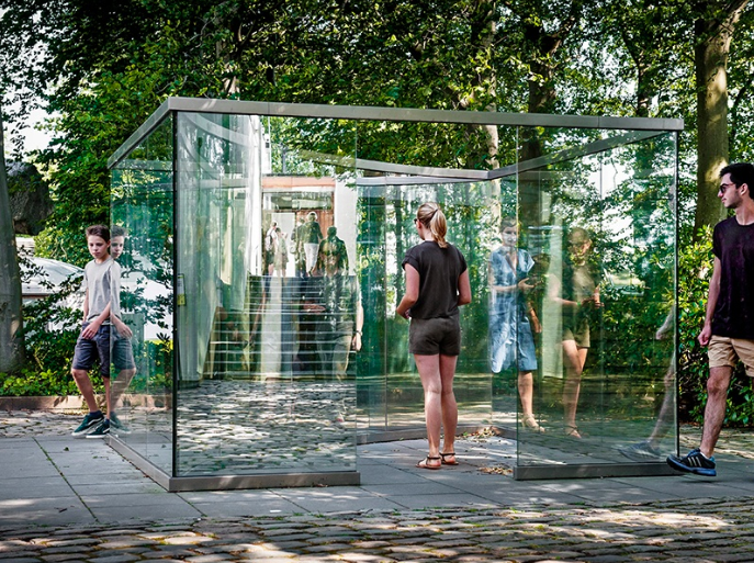The stainless-steel and two-way-mirror glass piece, Square Bisected by Curve by New York-based artist Dan Graham, is on display at the Louisiana Museum of Modern Art in Denmark. Photograph: Kim Hansen. Credit: Louisiana Museum of Modern Art.