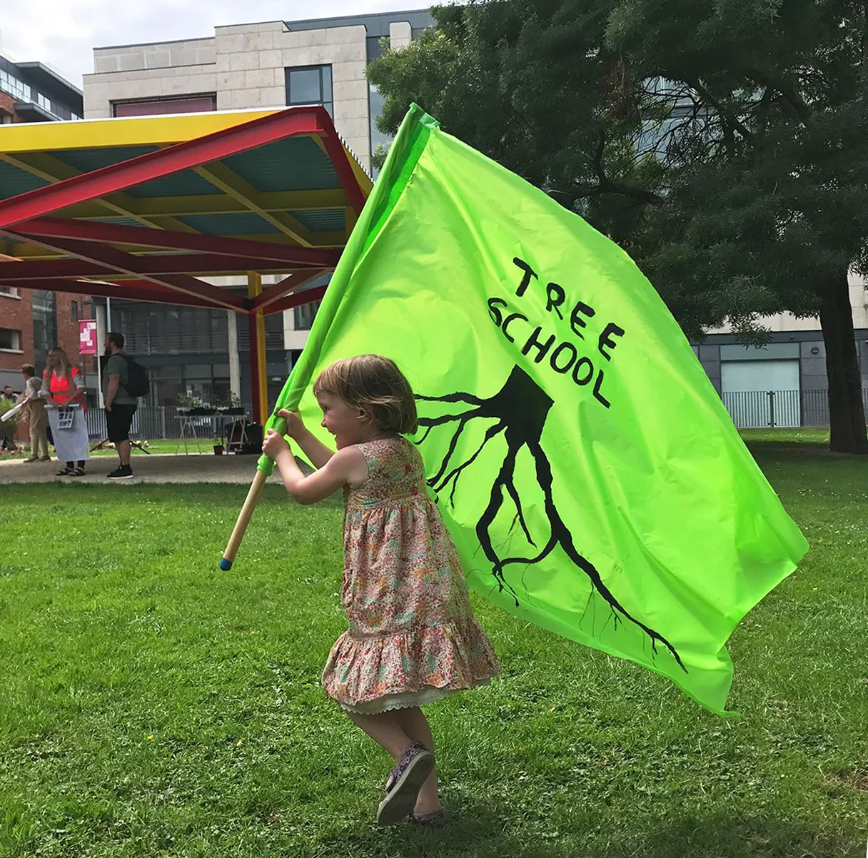 Tree School Seoidin's daughter with TREE SCHOOL FLAG.jpg