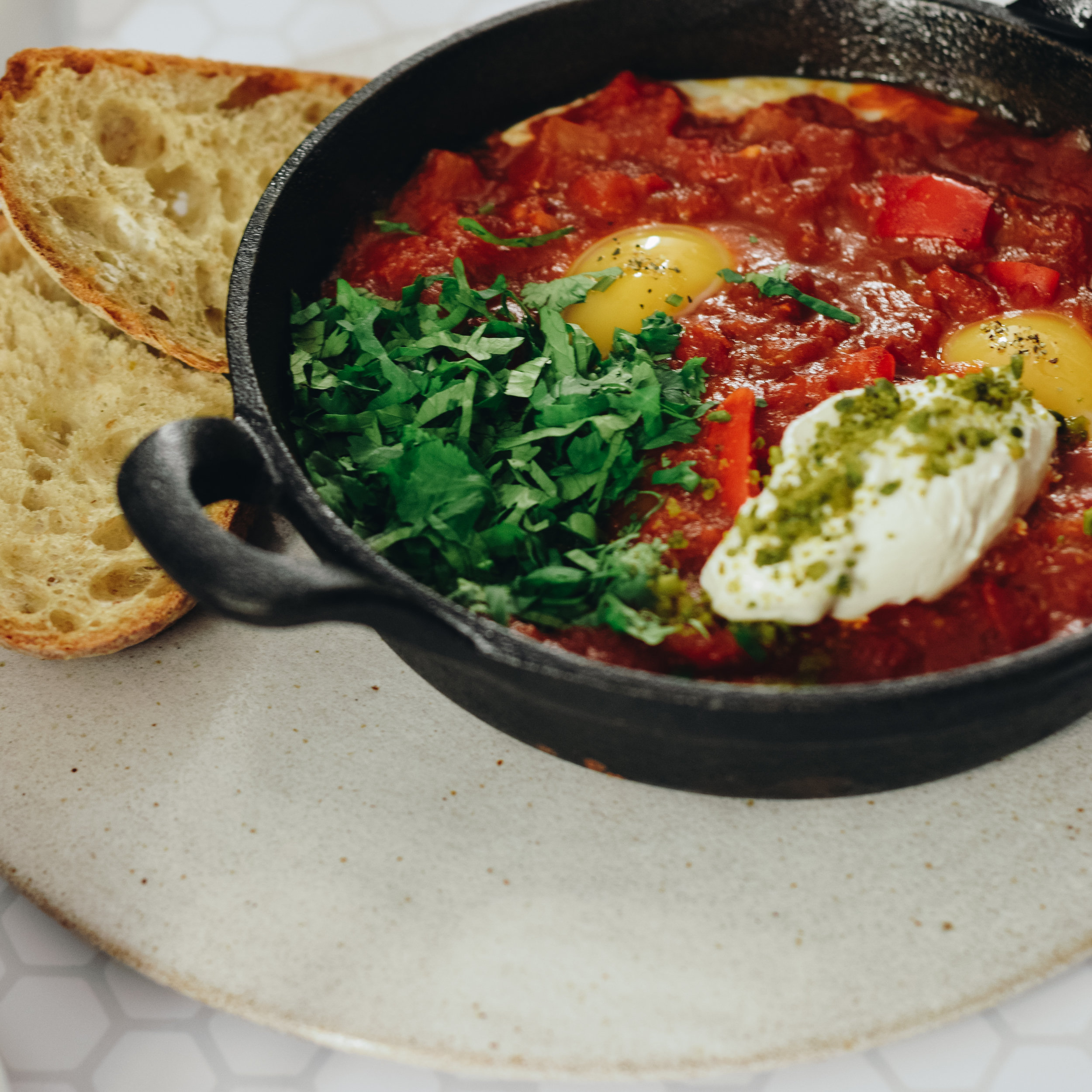 shakshuka with sour dough and yogurt 