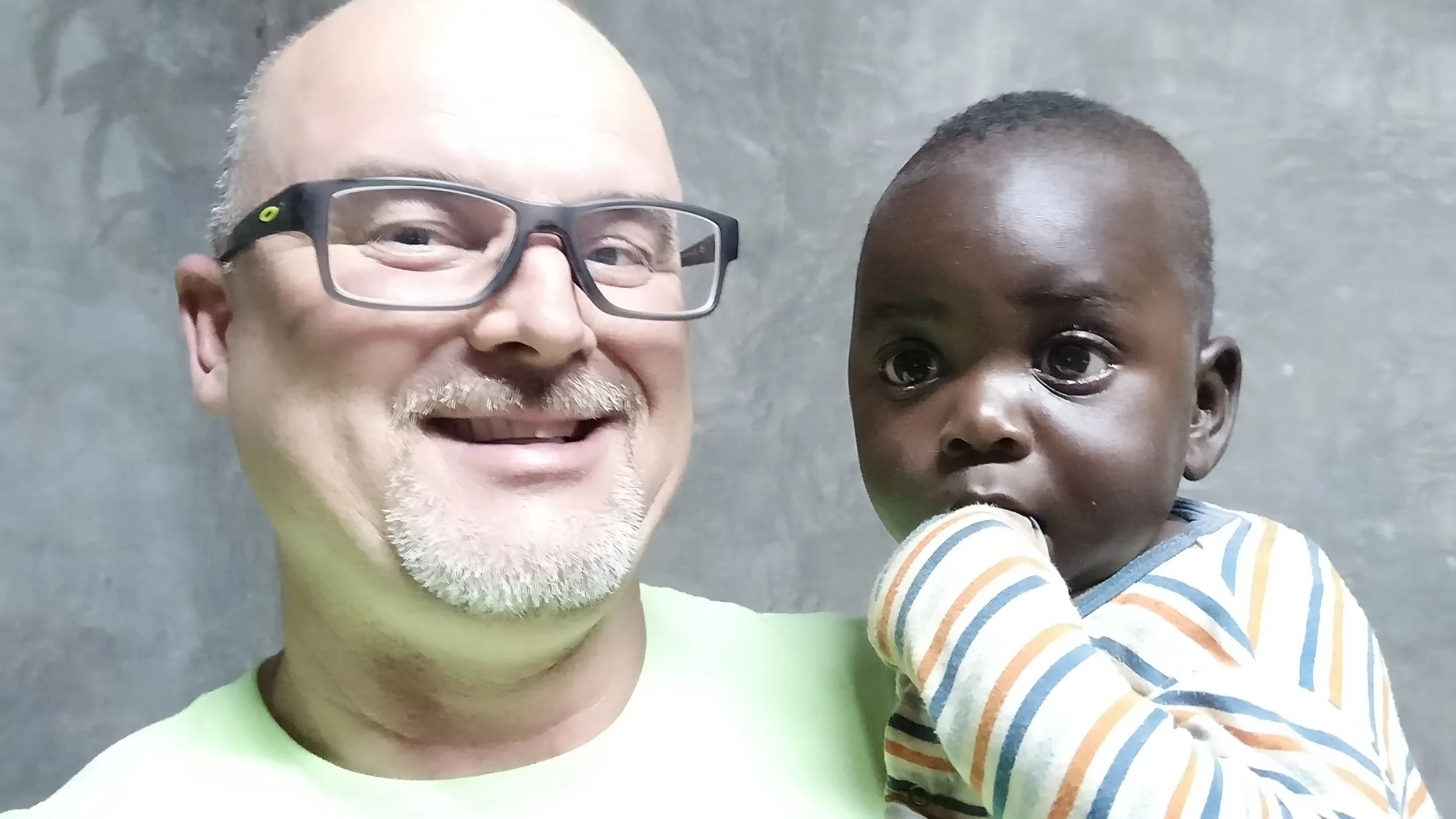 Me and our youngest member of Mercy Home, baby Zeke.