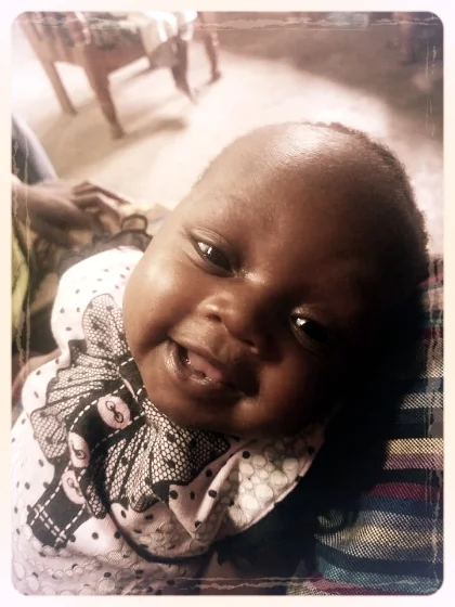 Minnie loves to smile at us! Our pretty girl is chunking up.