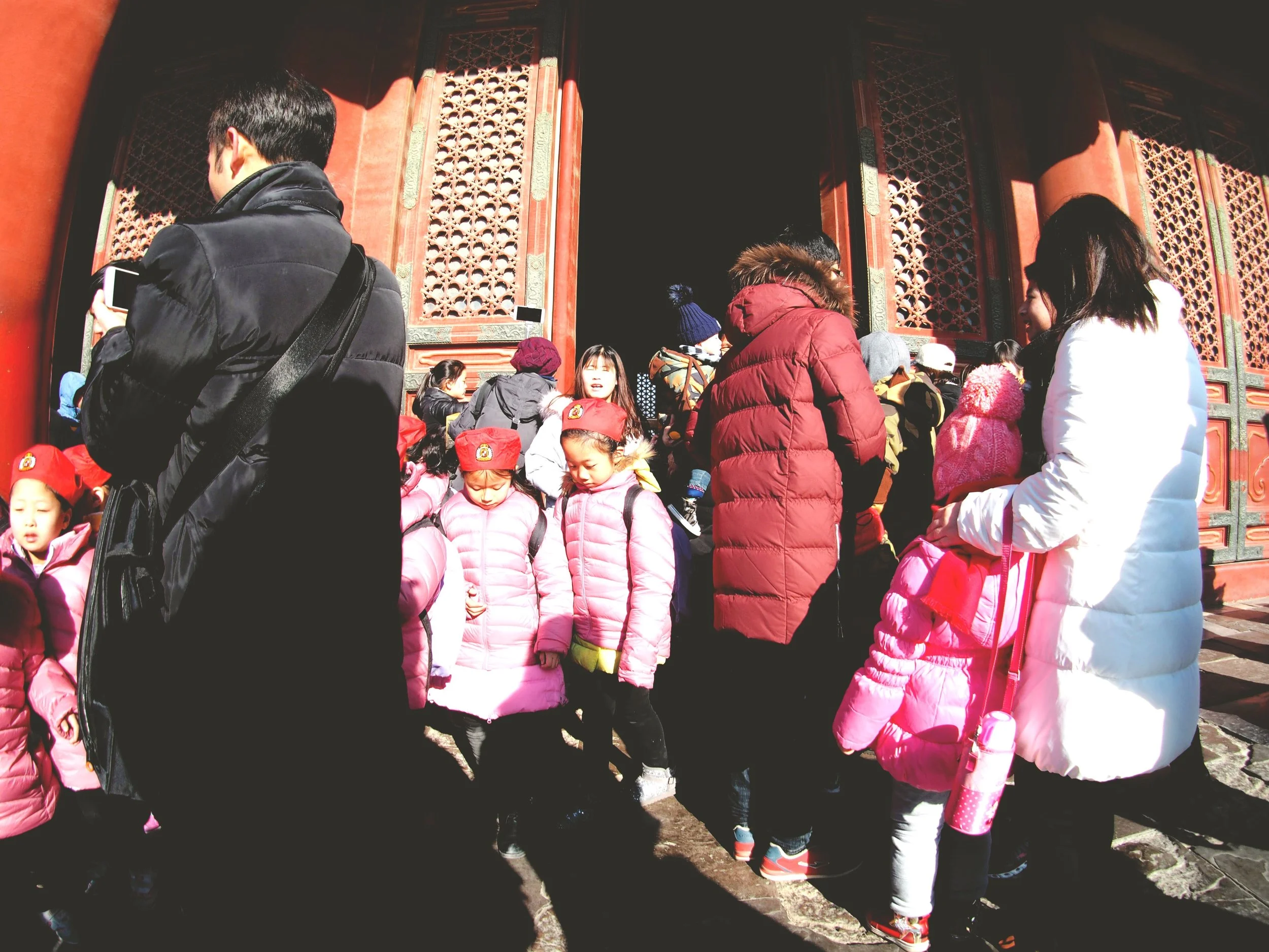 A warmly dressed tour group. 