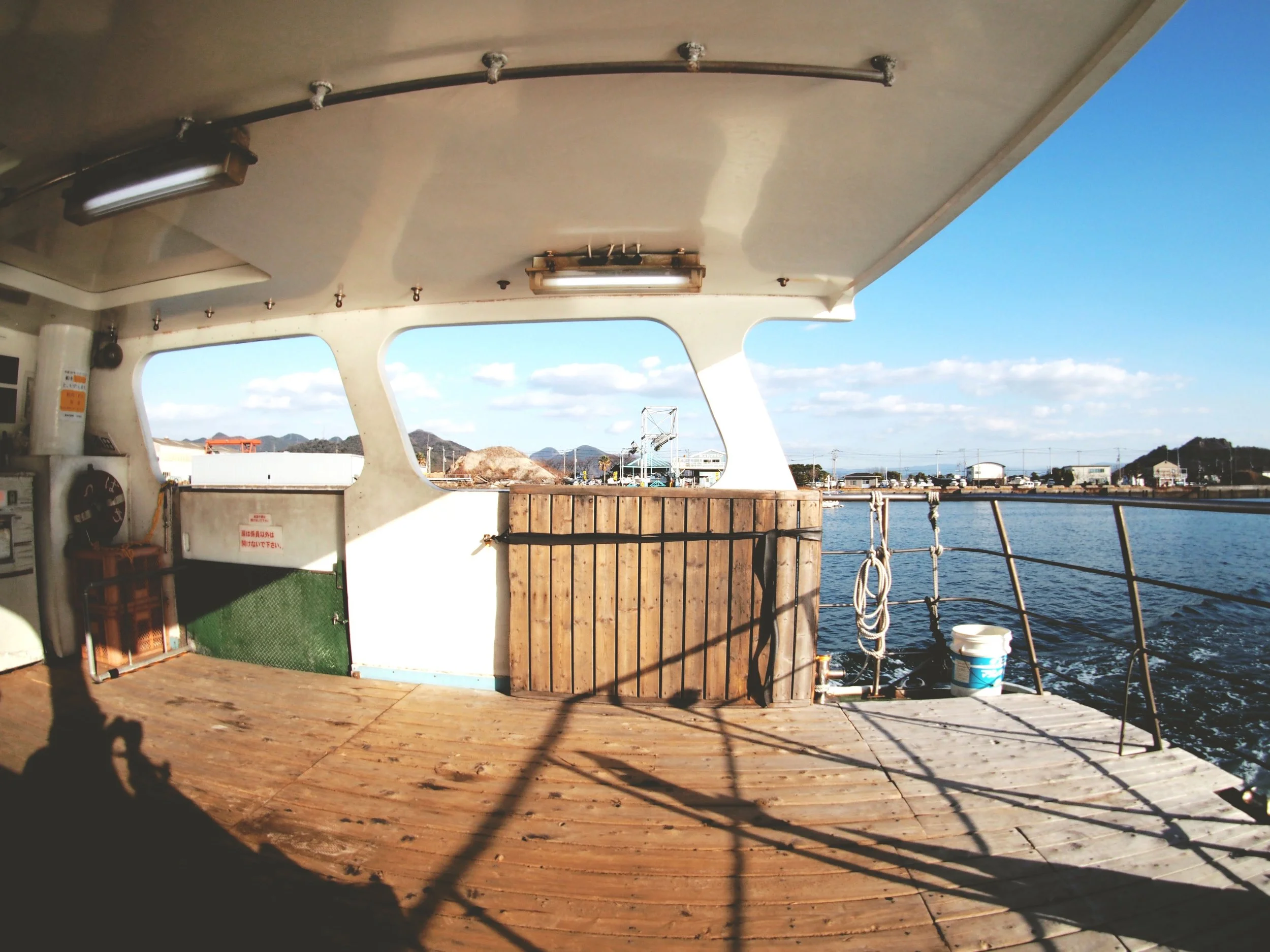We sat in the open back of the boat like weirdos. 