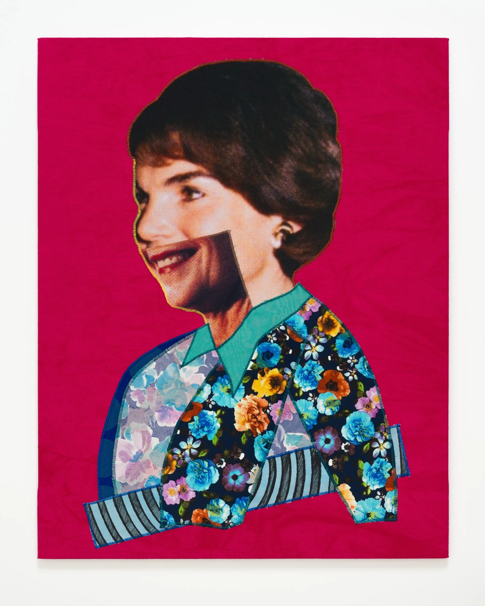 A First Lady in a blue flowered jacket grins with her mouth, but her eyes show concern.