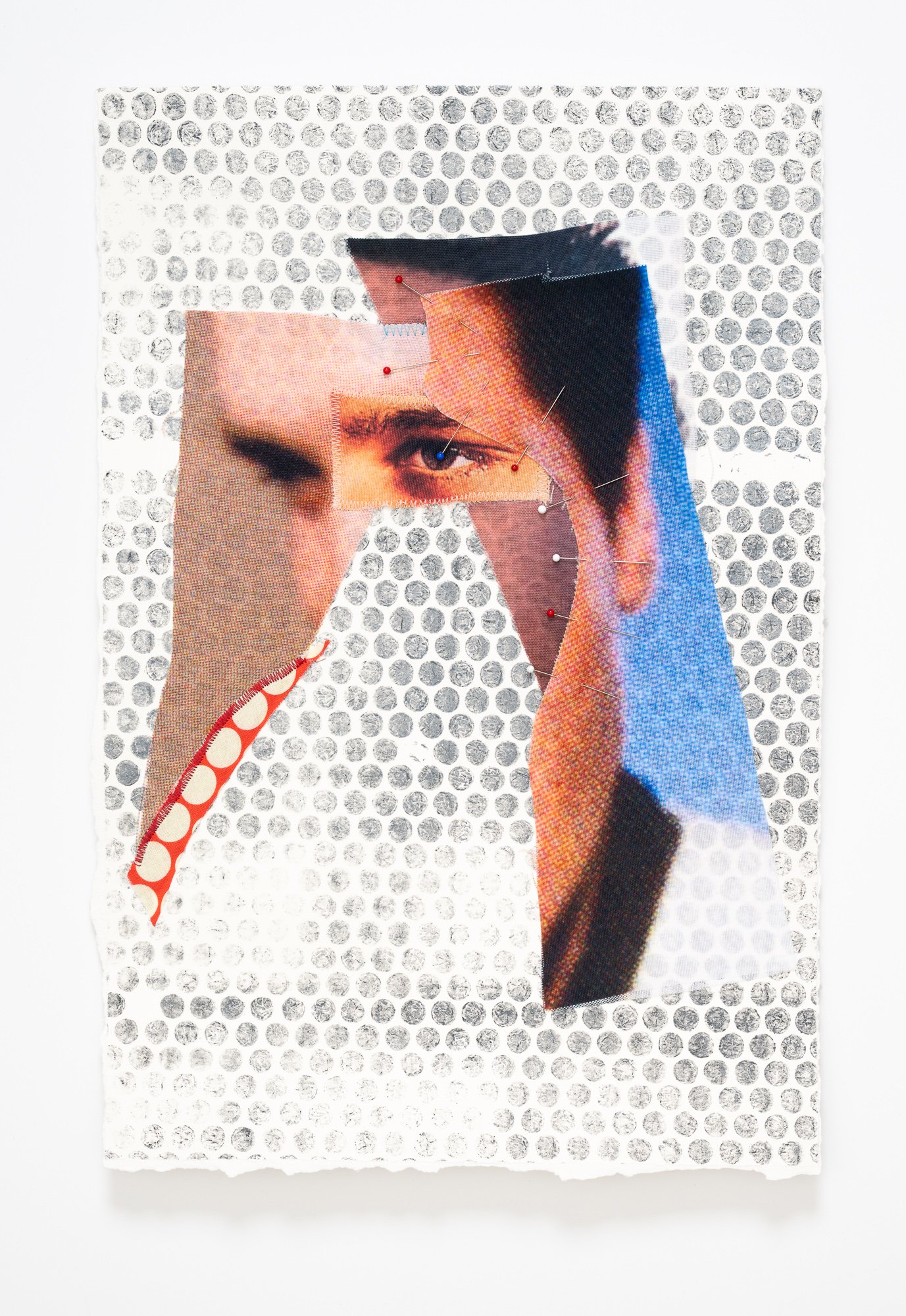 A fabric collage of Elvis Presley with stitched and pinned sections that make up his face.