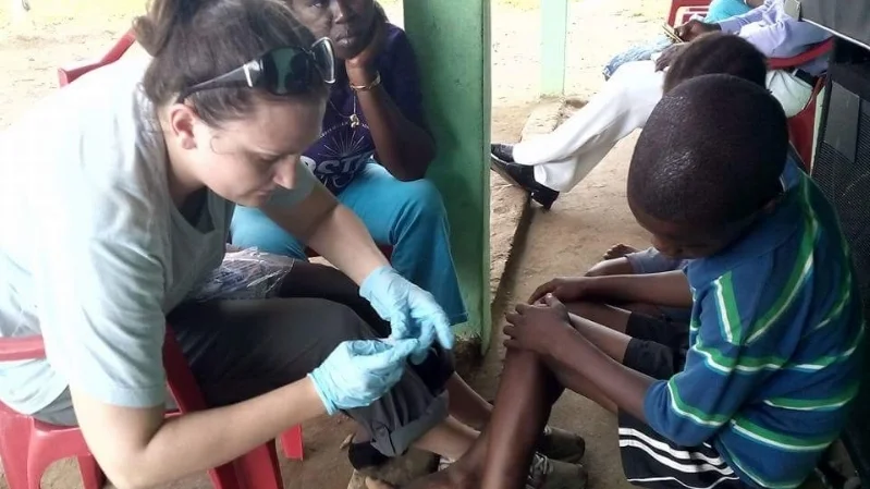 Missionary+caring+for+child's+cut+ankle.jpg