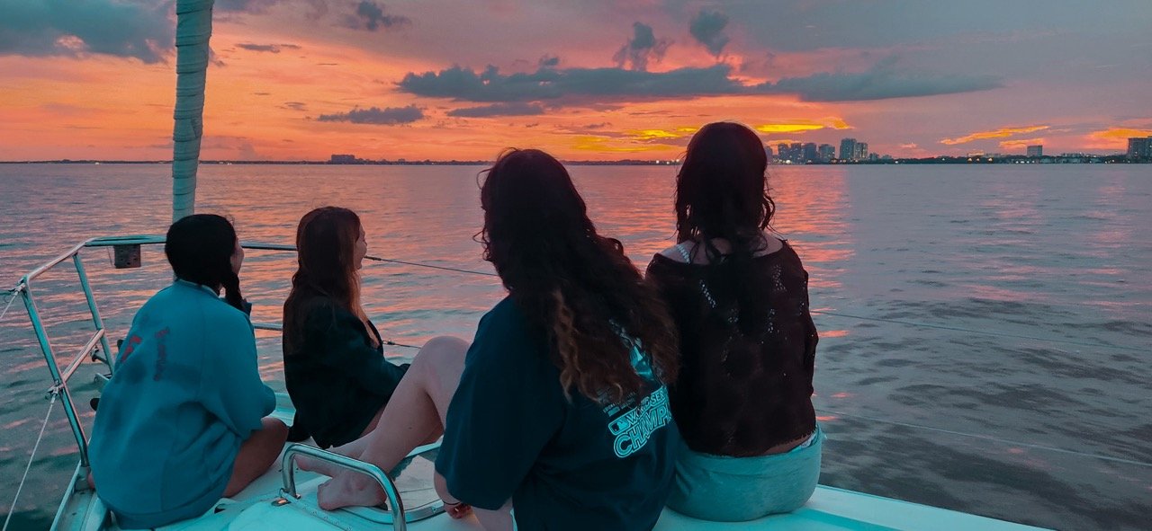 Girls by sunset Destino Sailboat charter in Miami.jpeg