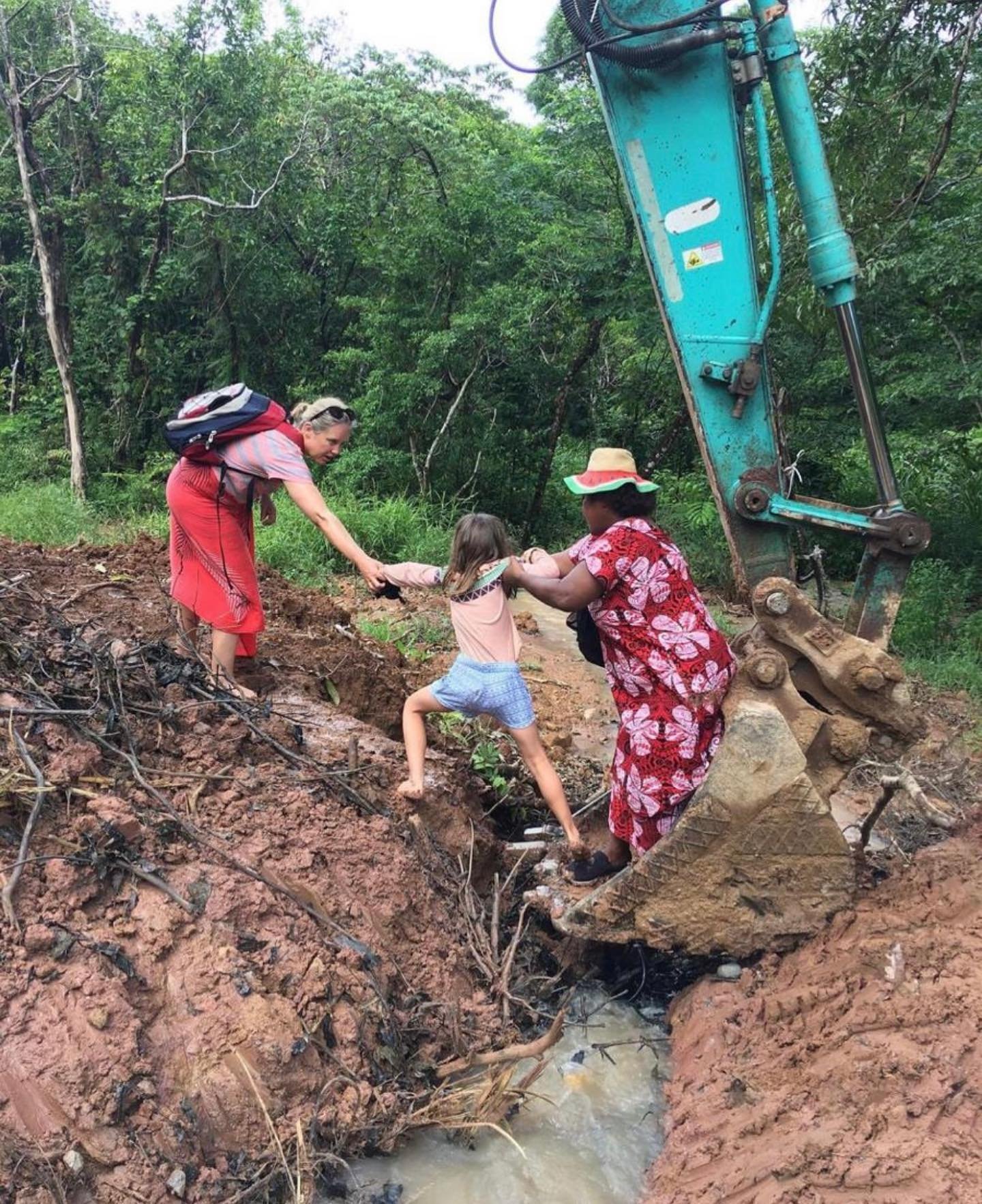 They say seeing is believing!

This photo shows just how far the Fiji Book Drive team will go for our work supporting literacy in Fiji. 

When visiting a school on the island of Kadavu, the only way of crossing the ditch was to hitch a ride in the ex