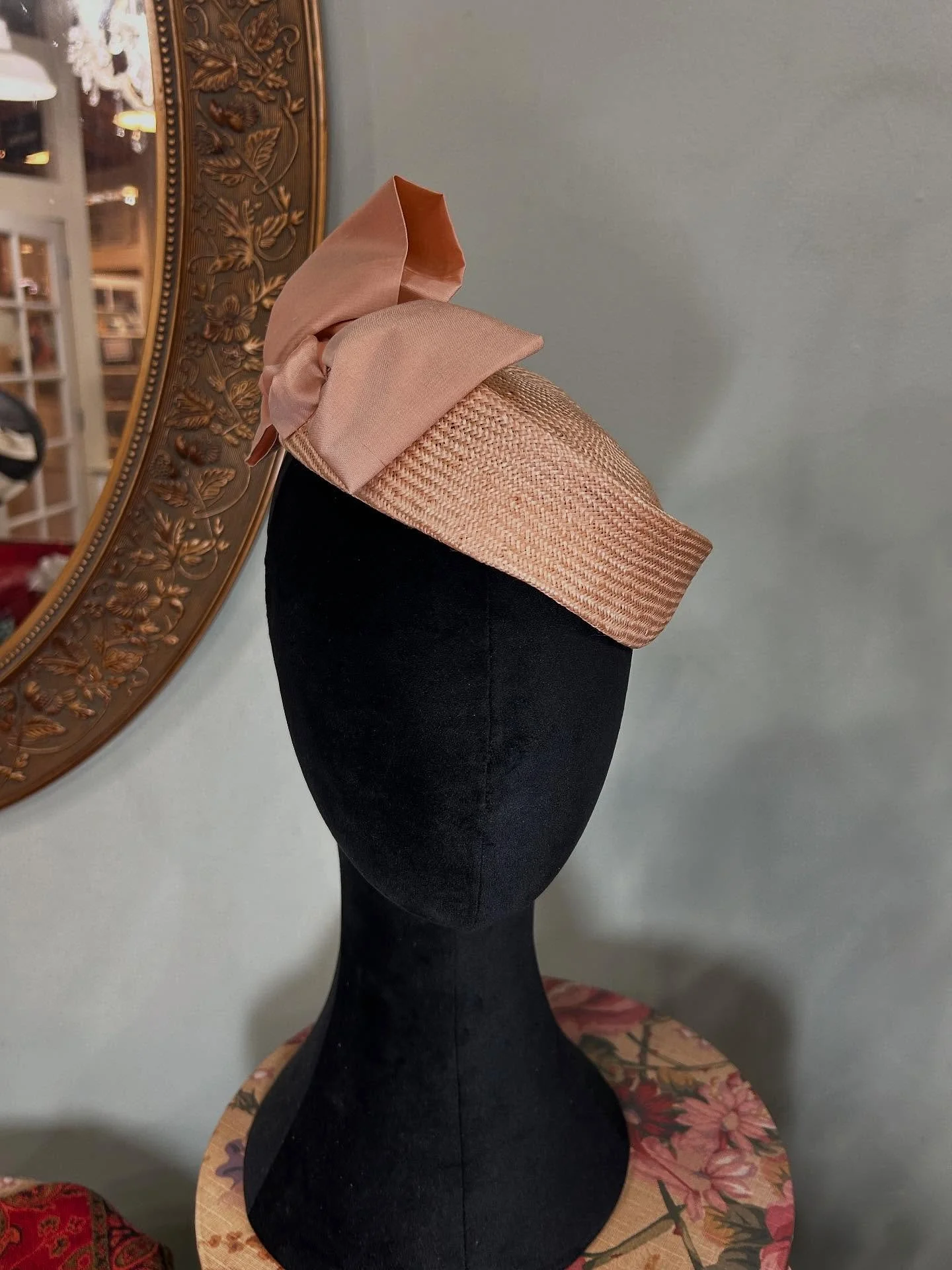 Jaunty peach colored parasisal straw hat with matching silk taffeta bow put out in the shop last week. I know she is new, but as she is a straw, she is on sale for 40% off like all the rest of the straws. One week more and then any straws get packed 