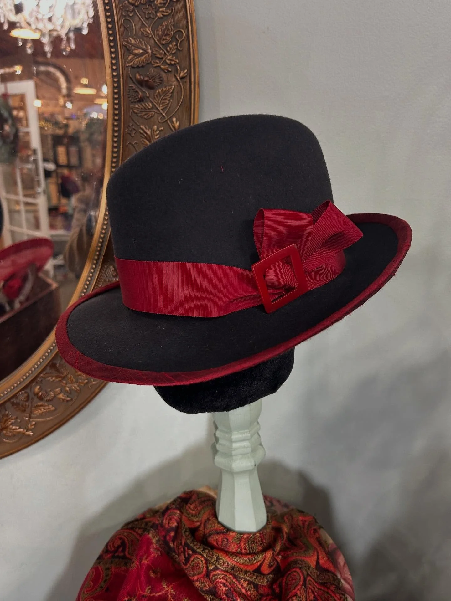 Charcoal fur felt slanted crown ladies fedora just put out in the shop today for winter. Edged in red silk  dupioni and banded with wide vintage petersham ending in a double loop topped off with a vintage red buckle this fedora is ready to liven up e