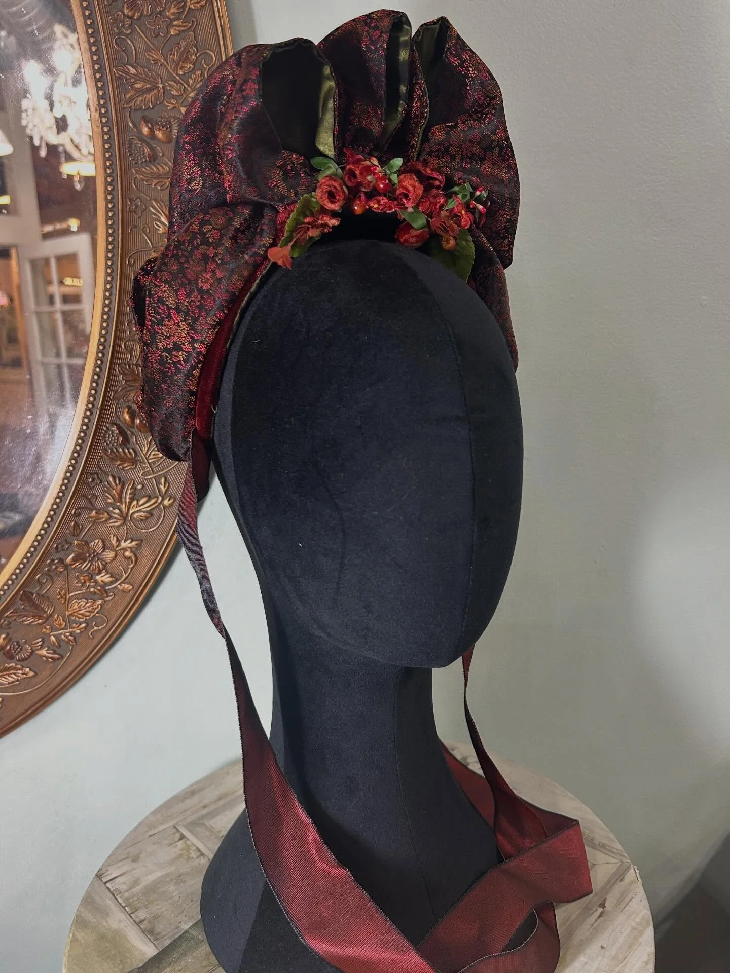 Bustle bonnet in rust silk velvet and a fabulous rust and black small floral woven  silk  lined in olive silk just finished and packed away for Costume College in late July.  Love the beading on the back of the bonnet and the small vintage flowers tu