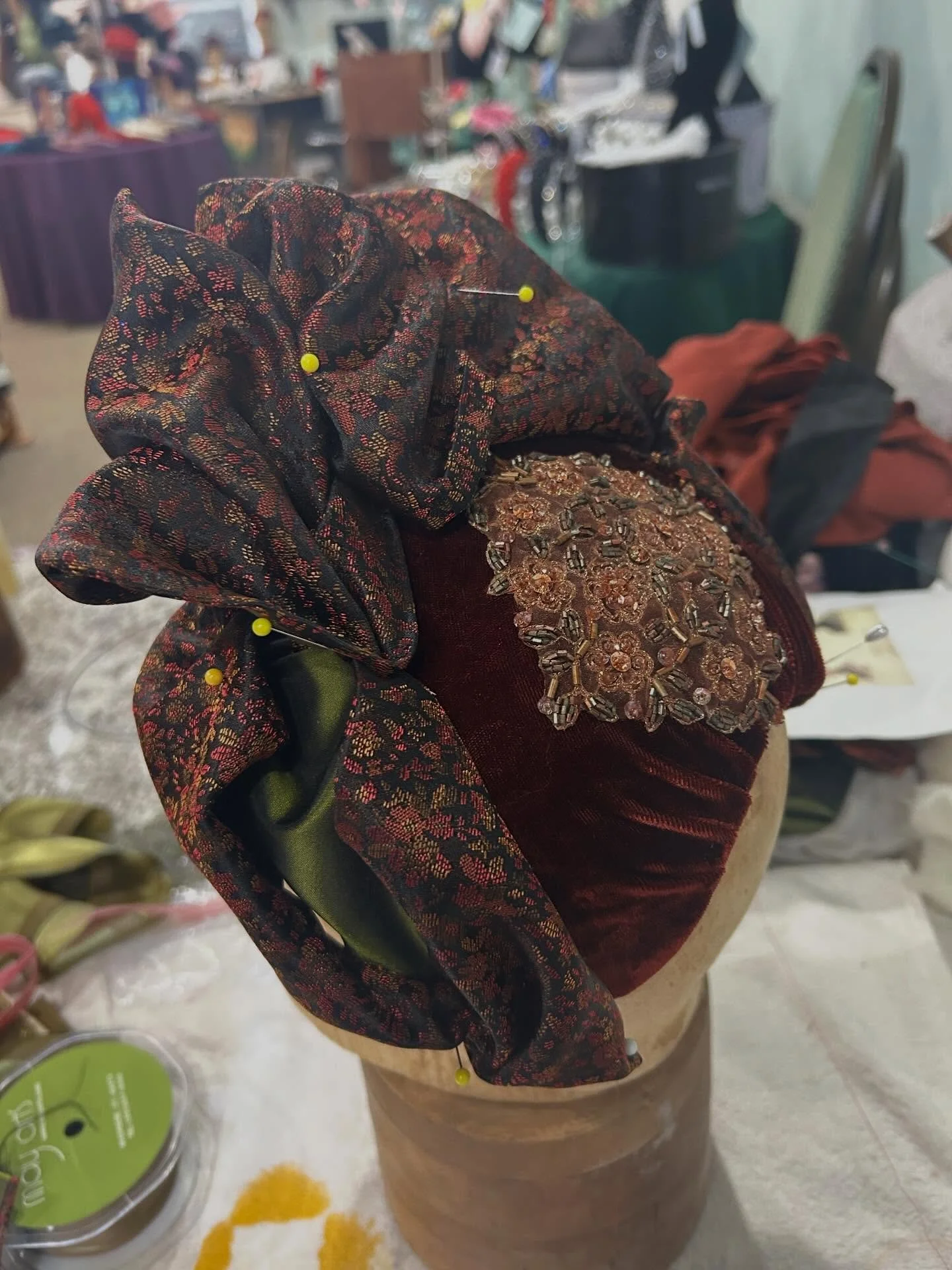 What&rsquo;s on your work table today? Working on an 1880&rsquo;s bonnet in rust silk velvet and brocade lined in olive green silk taffeta for Costume College. #victorianbonnet #gildedagefashion #handmademillinery #handmadehat #victorianfashion costu