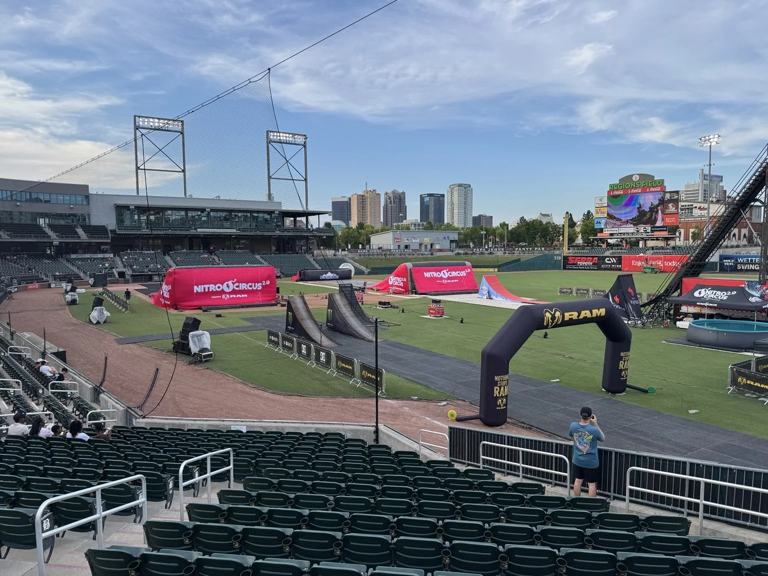 Nitro Circus ramps and course arranged across Regions Field with the Birmingham skyline beyond the stadium