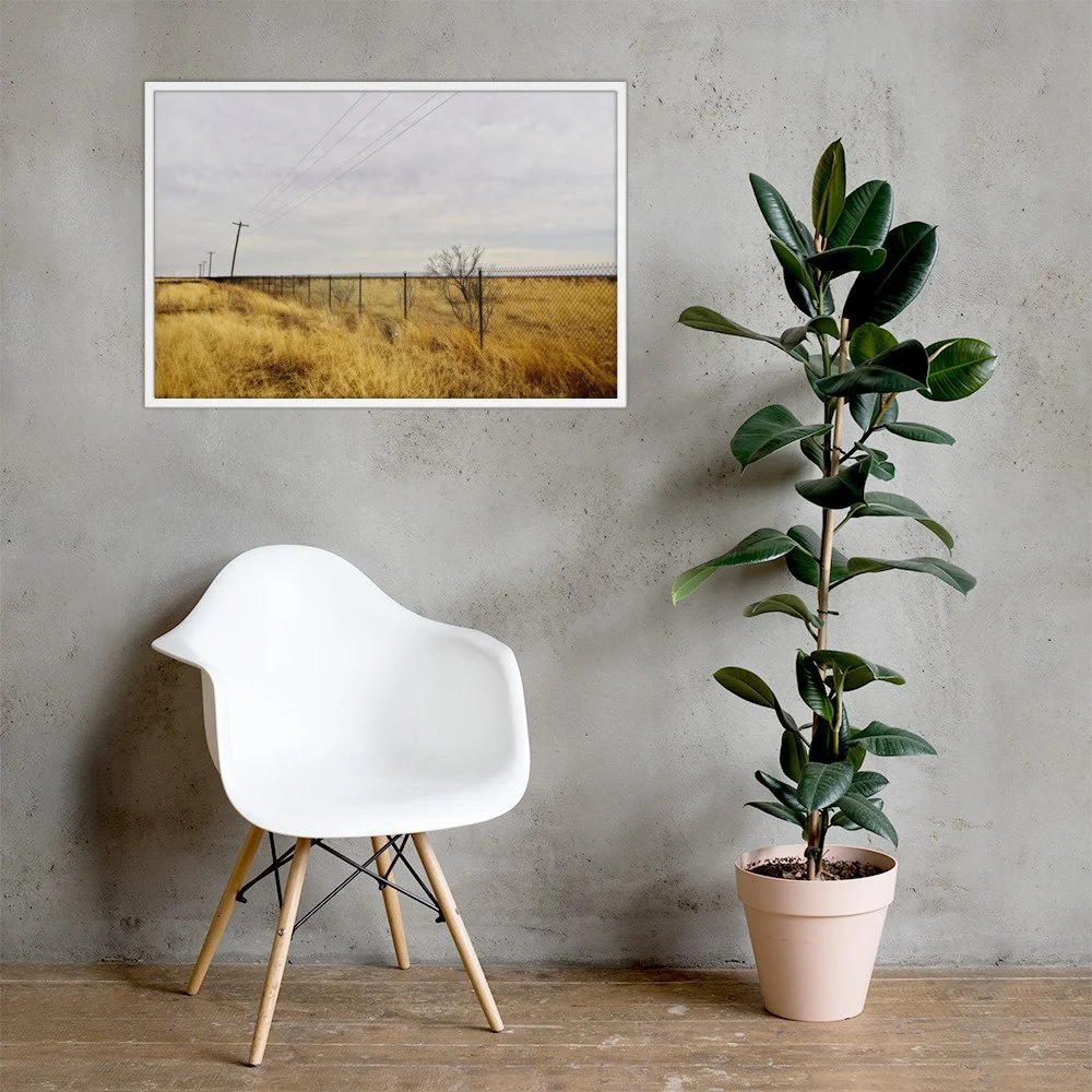 FENCE LINE / 003 framed fence and utility-pole photograph by Nathon Ruehl in a concrete-wall interior