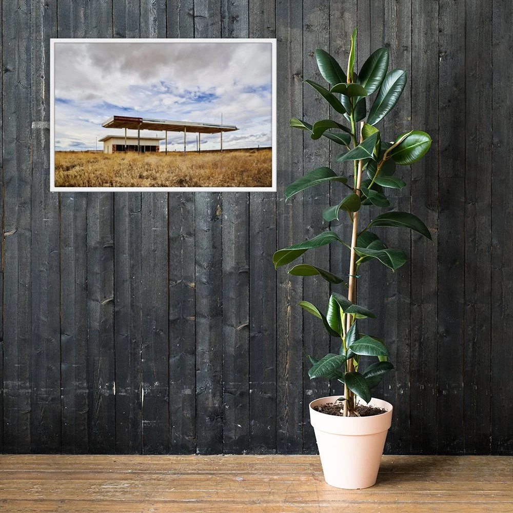 VACANCY / 006 framed abandoned roadside station photograph by Nathon Ruehl on a dark wood wall