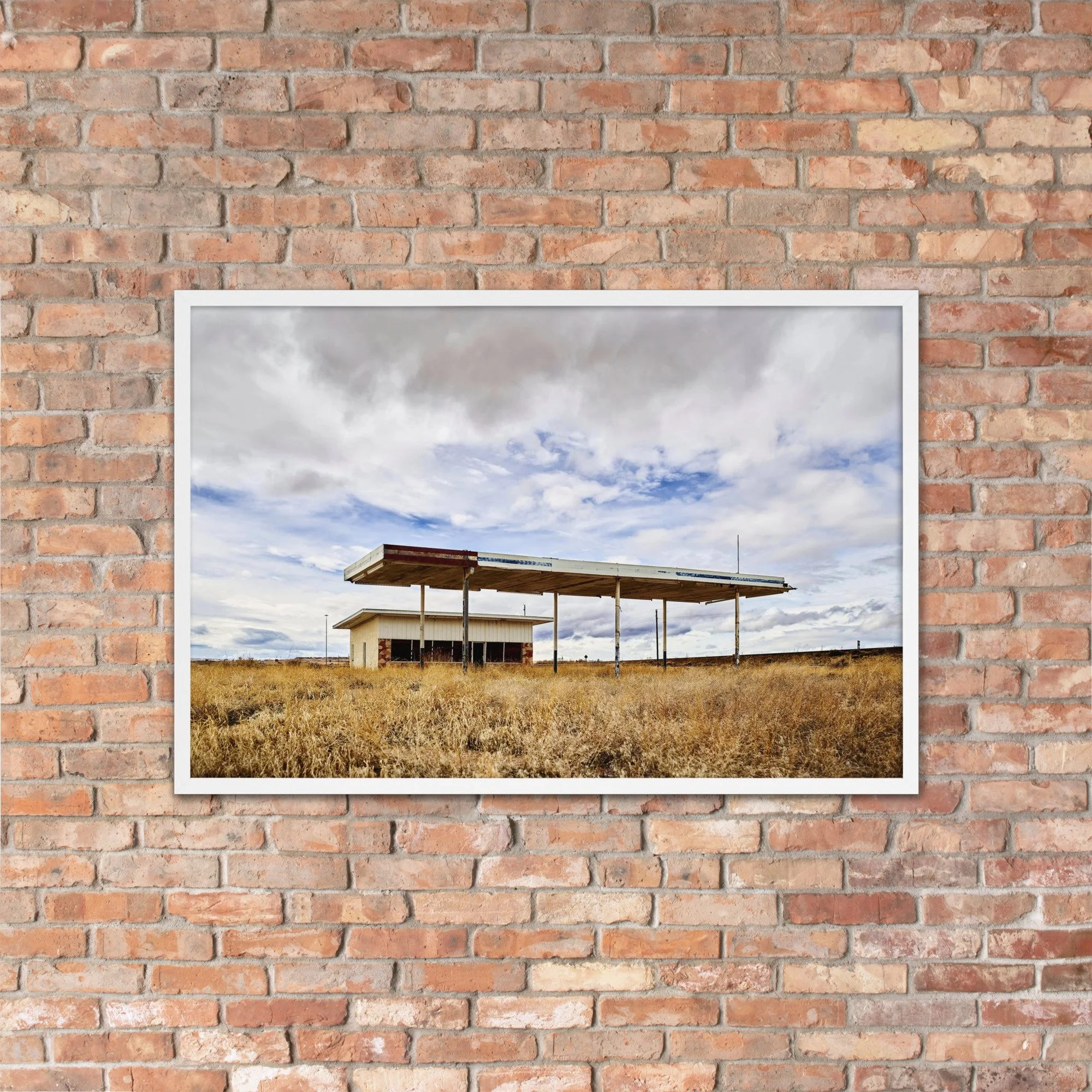 VACANCY / 006 framed abandoned roadside station photograph by Nathon Ruehl on a brick wall