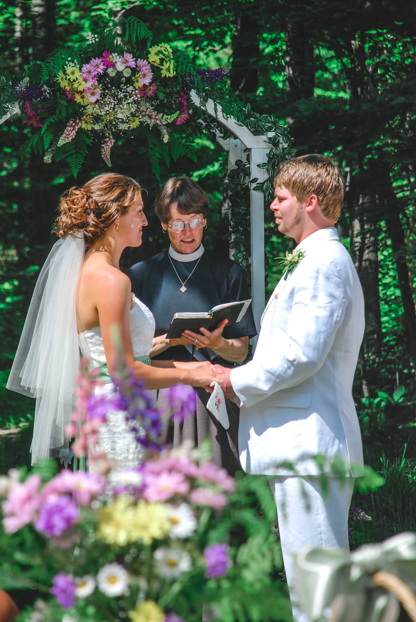Backyard Wisconsin wedding vow exchange