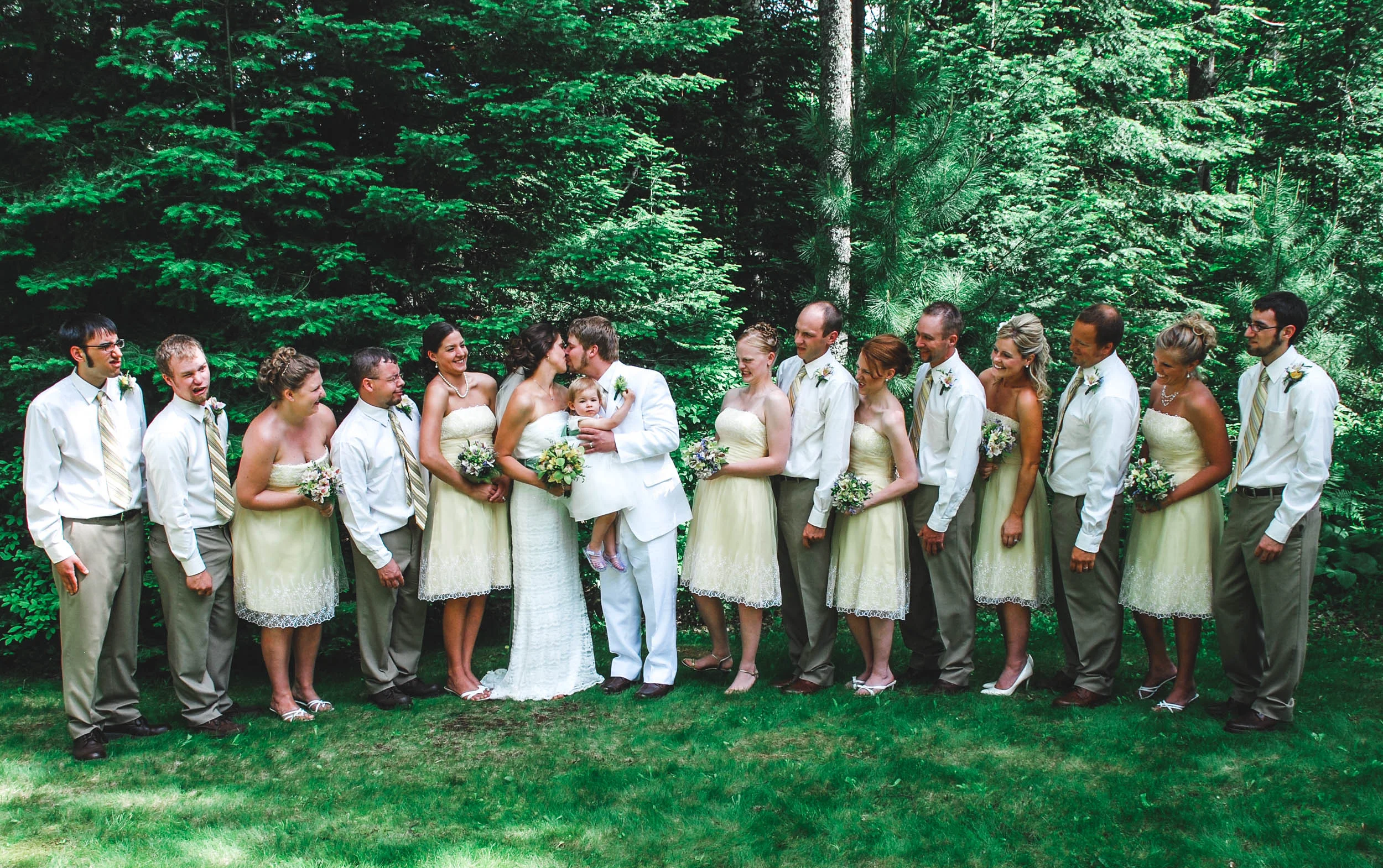 Funny wedding party photo after outdoor wedding