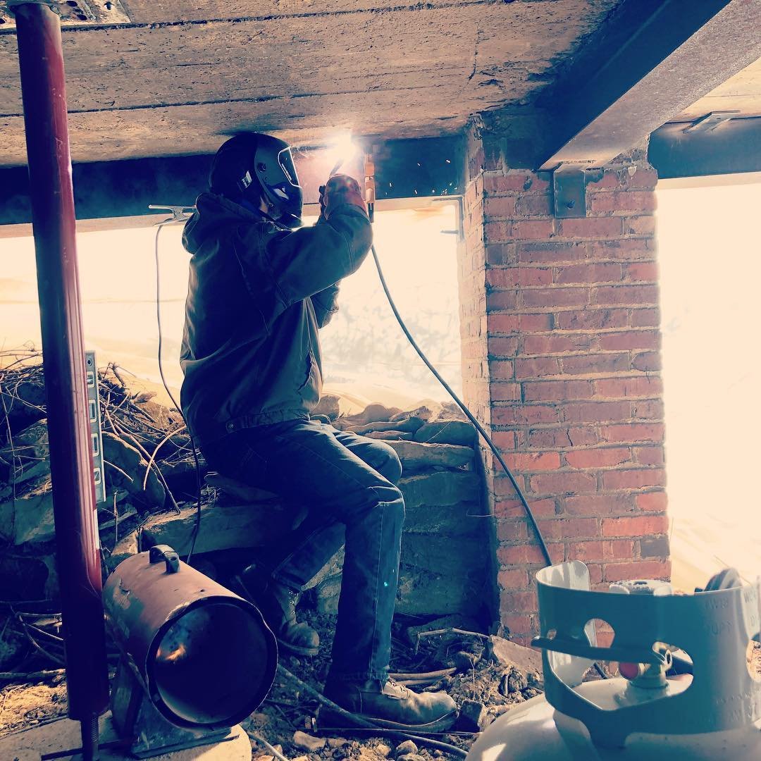 Structural repairs on a collapsing garage.