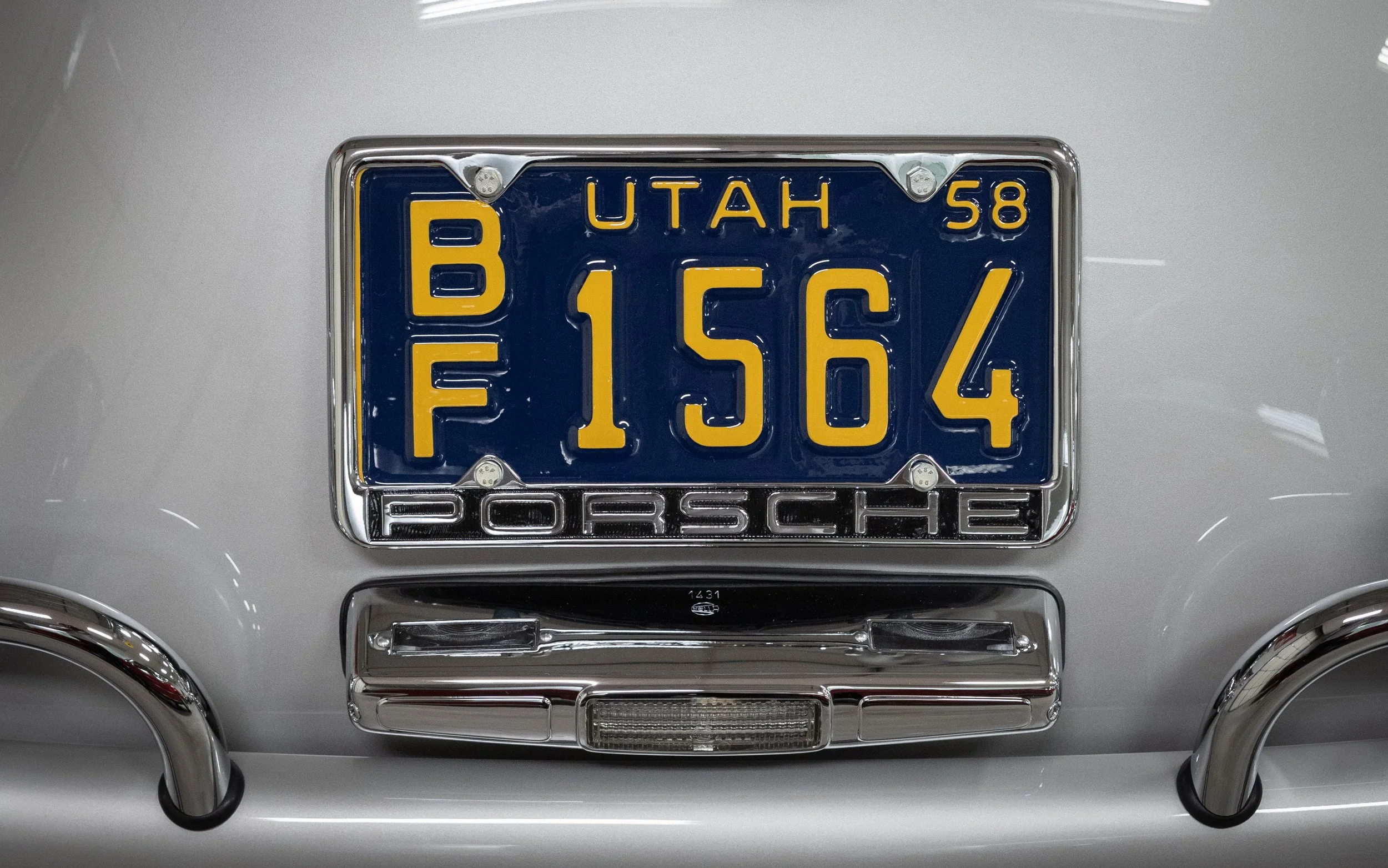 Framed and restored, blue and yellow, 1958 Utah license plate.