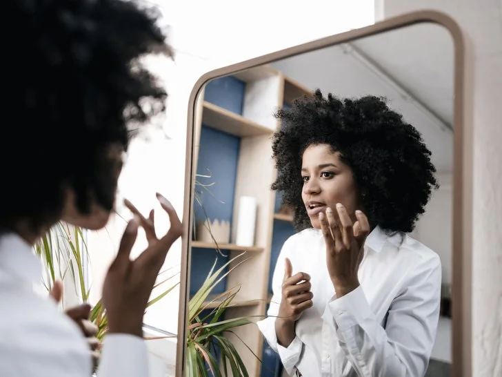 woman-looking-in-mirror.jpg