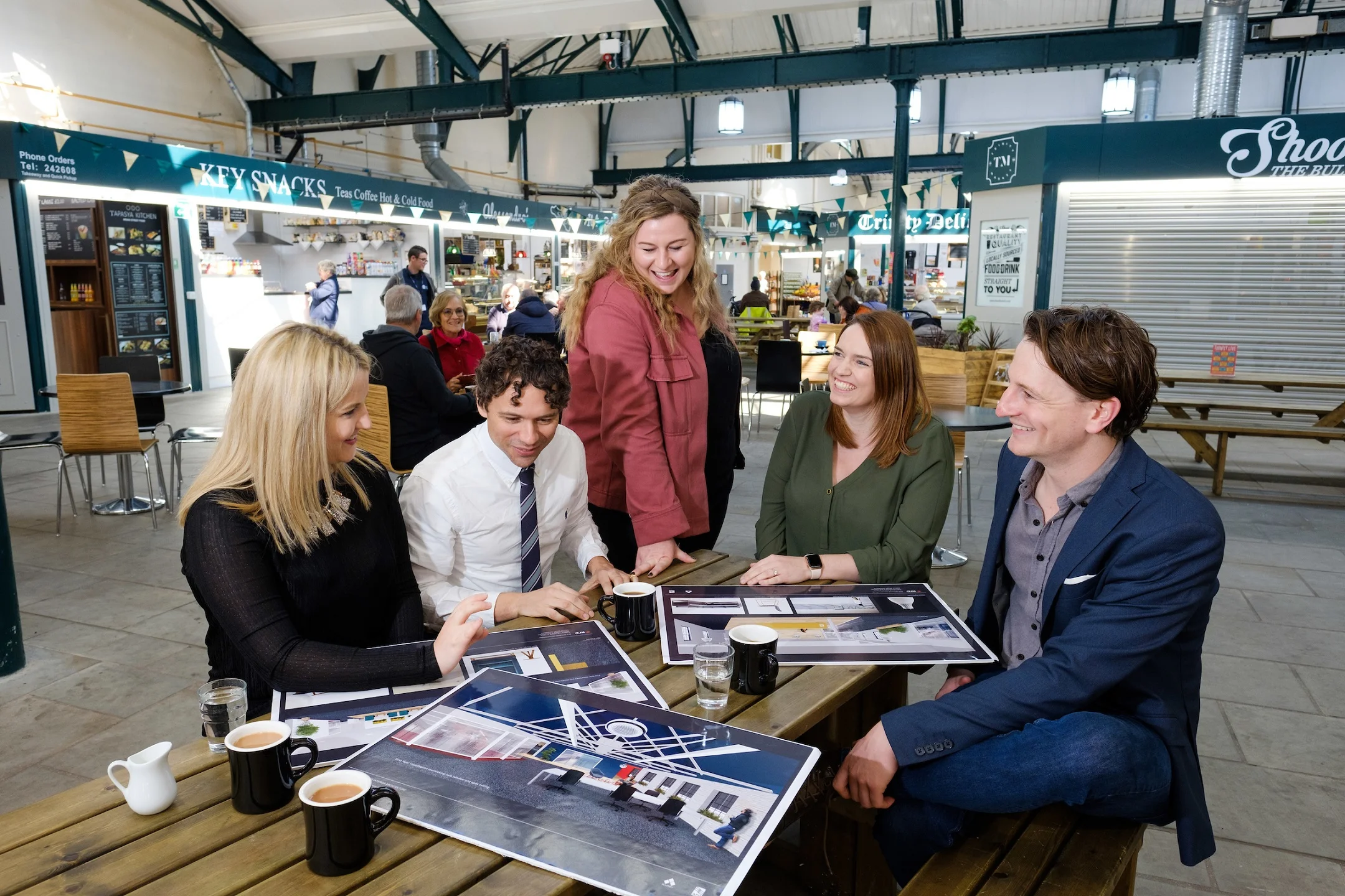 From left, APD’s Jane Cross, Alex Jenneson of RFD, Georgia Allenby of Allenby Commercial, APD’s Rhiannon Beeson and Allenby Commercial’s Charlie Allenby enjoy a relaxing moment in Hull’s thriving Trinity Market food hall, which is just yards from APD’s new offices.