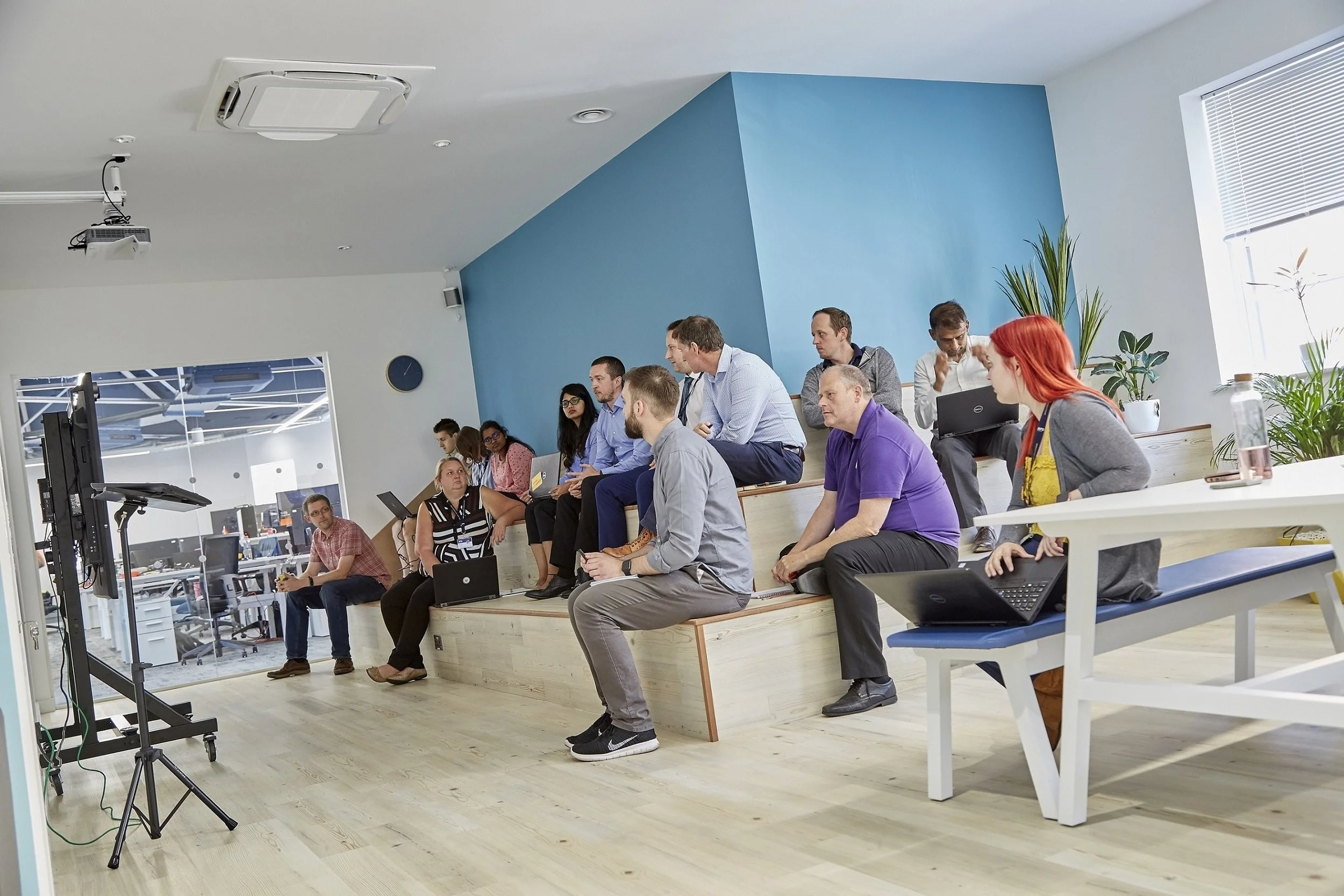 APD developers work together in a “sprint” session in the presentation zone at the pioneering tech company’s new headquarters.